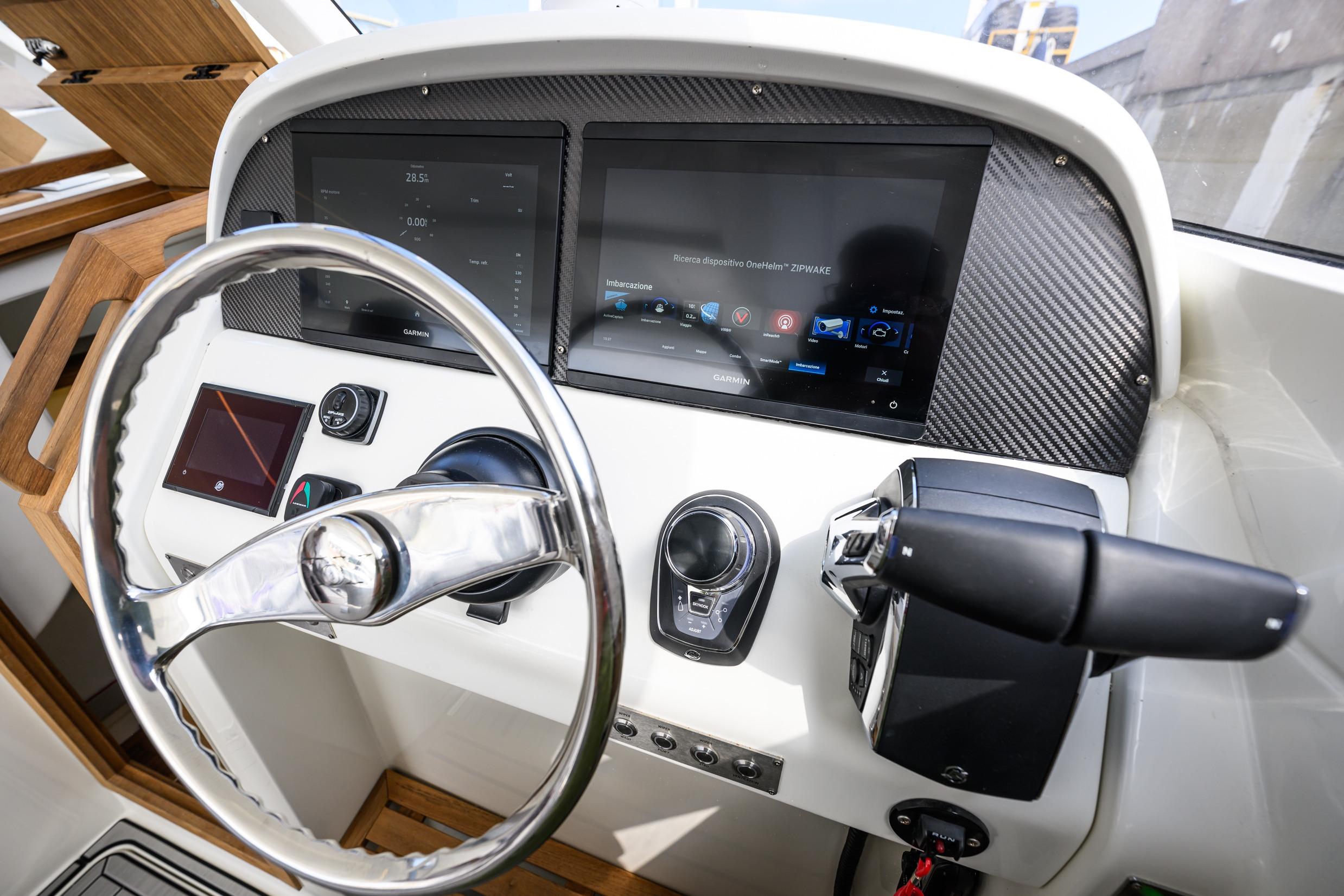 Steering console of Toy 39 boat, featuring advanced navigation displays, 2025 model.