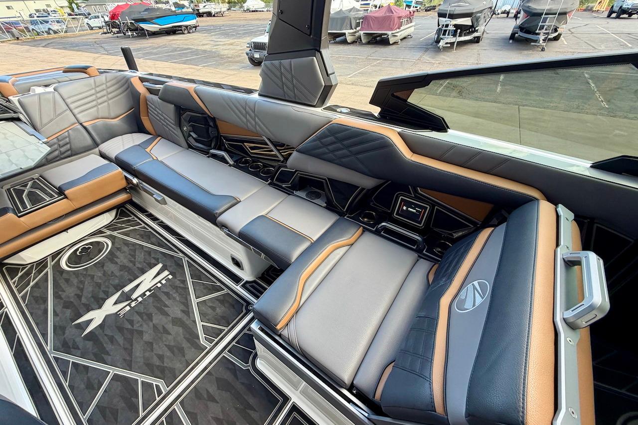 Luxurious interior of 2025 Tigé Ultré 25ZX boat with stylish seating and modern design.