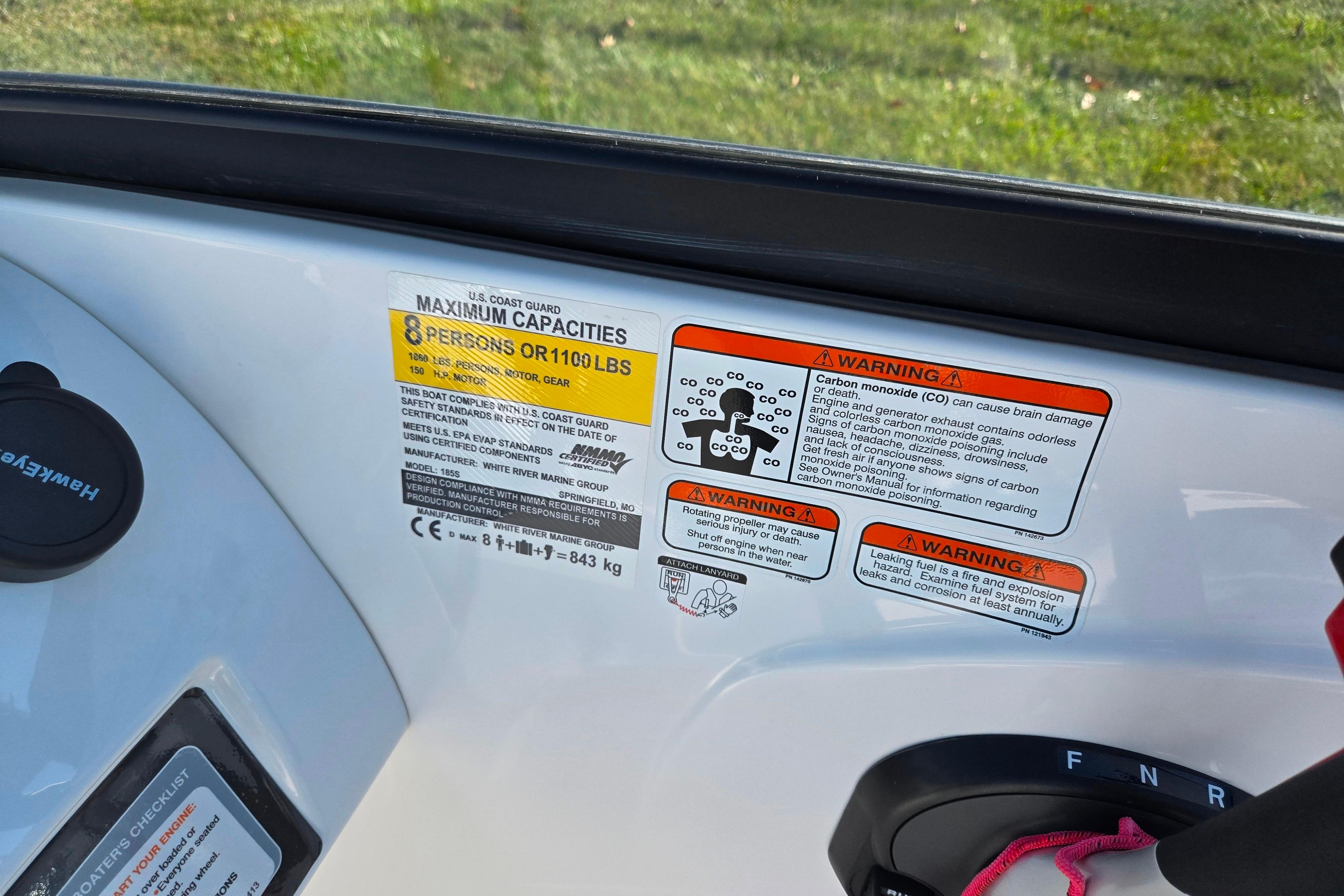 2023 Tahoe 185 S boat capacity and safety warning labels, maximum 8 persons or 1100 lbs.