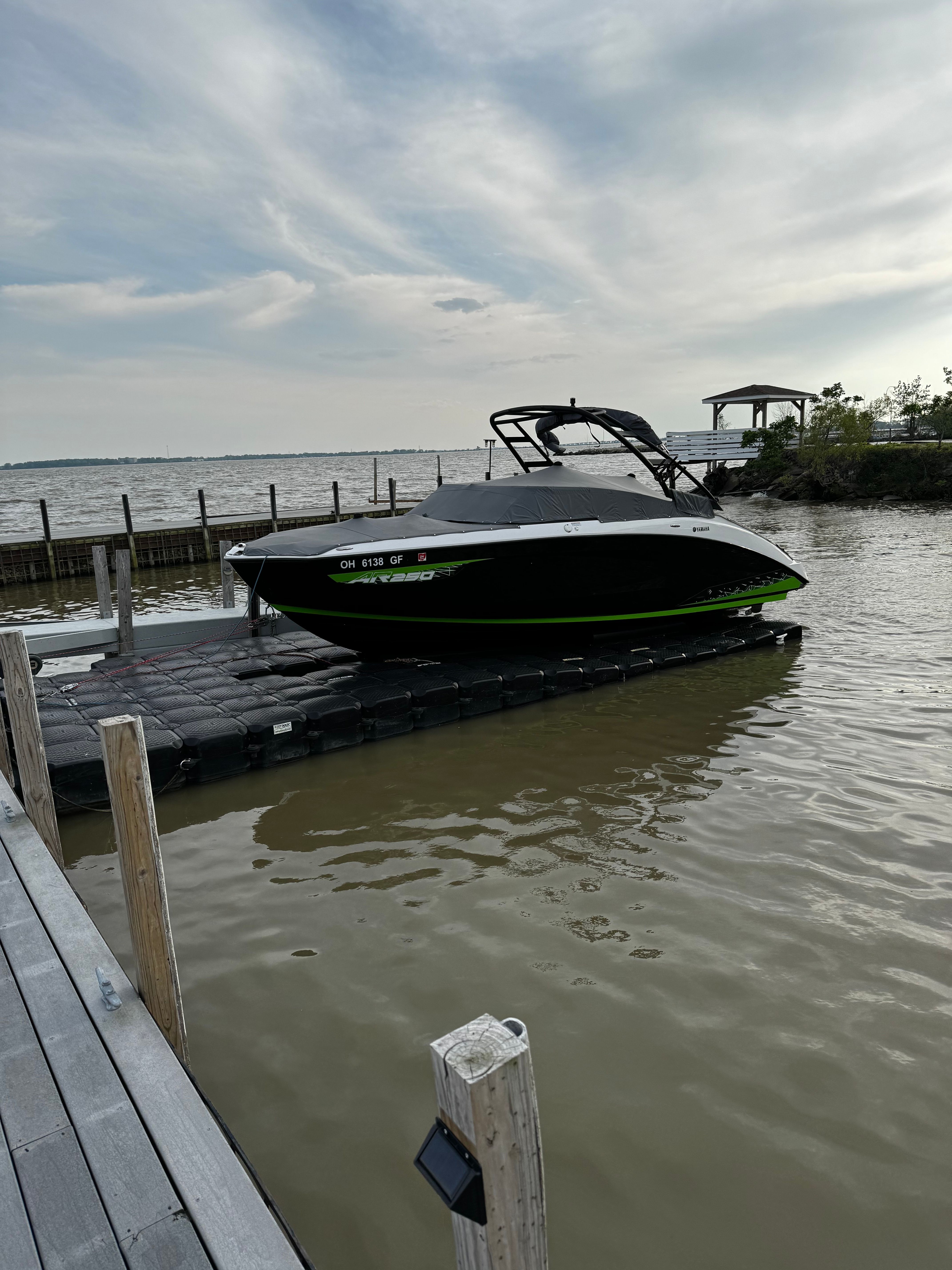 2021 Yamaha AR250 boat docked on calm water.