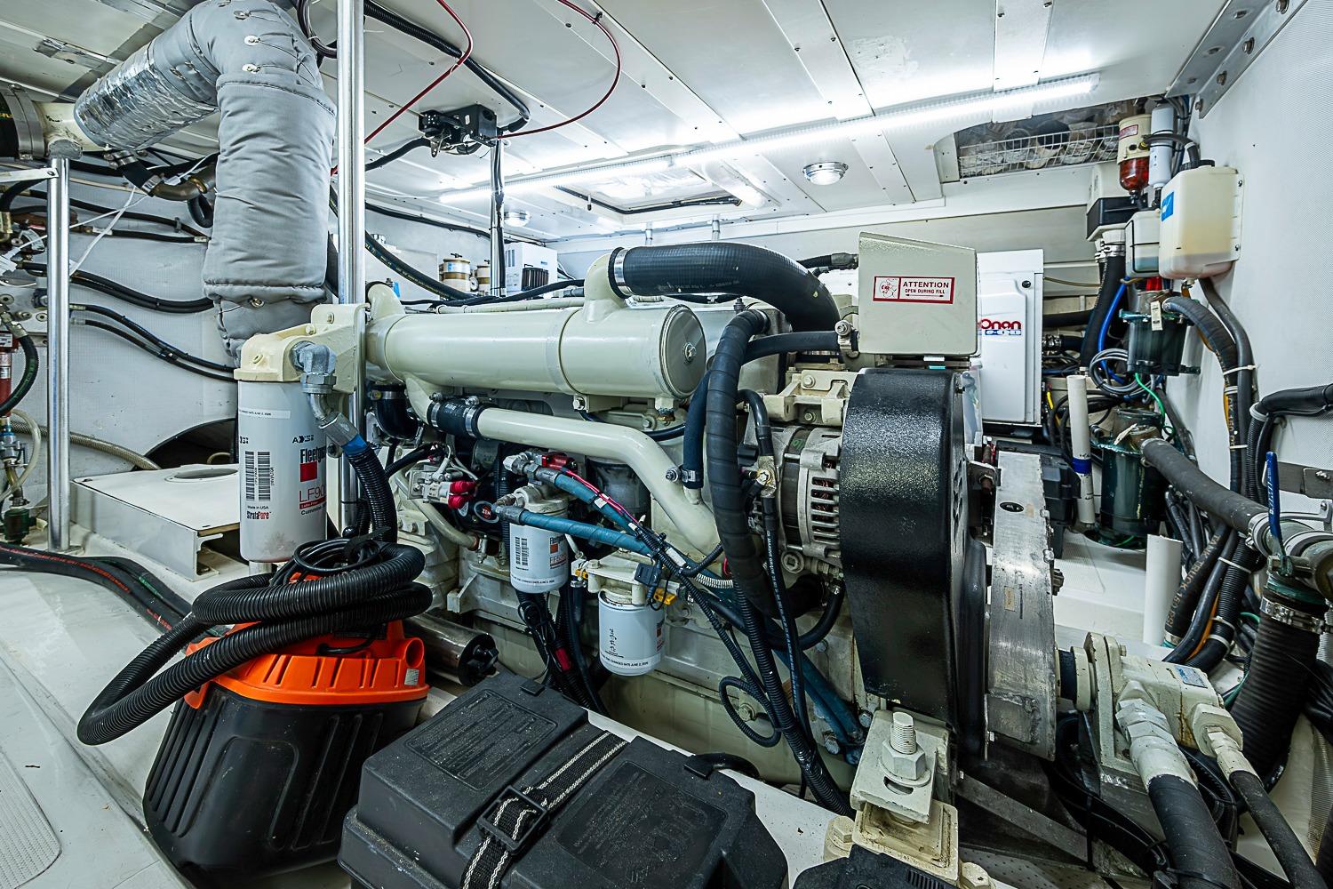 Engine room of 2003 Magna Marine Nova Scotia 47, showcasing detailed mechanical components.