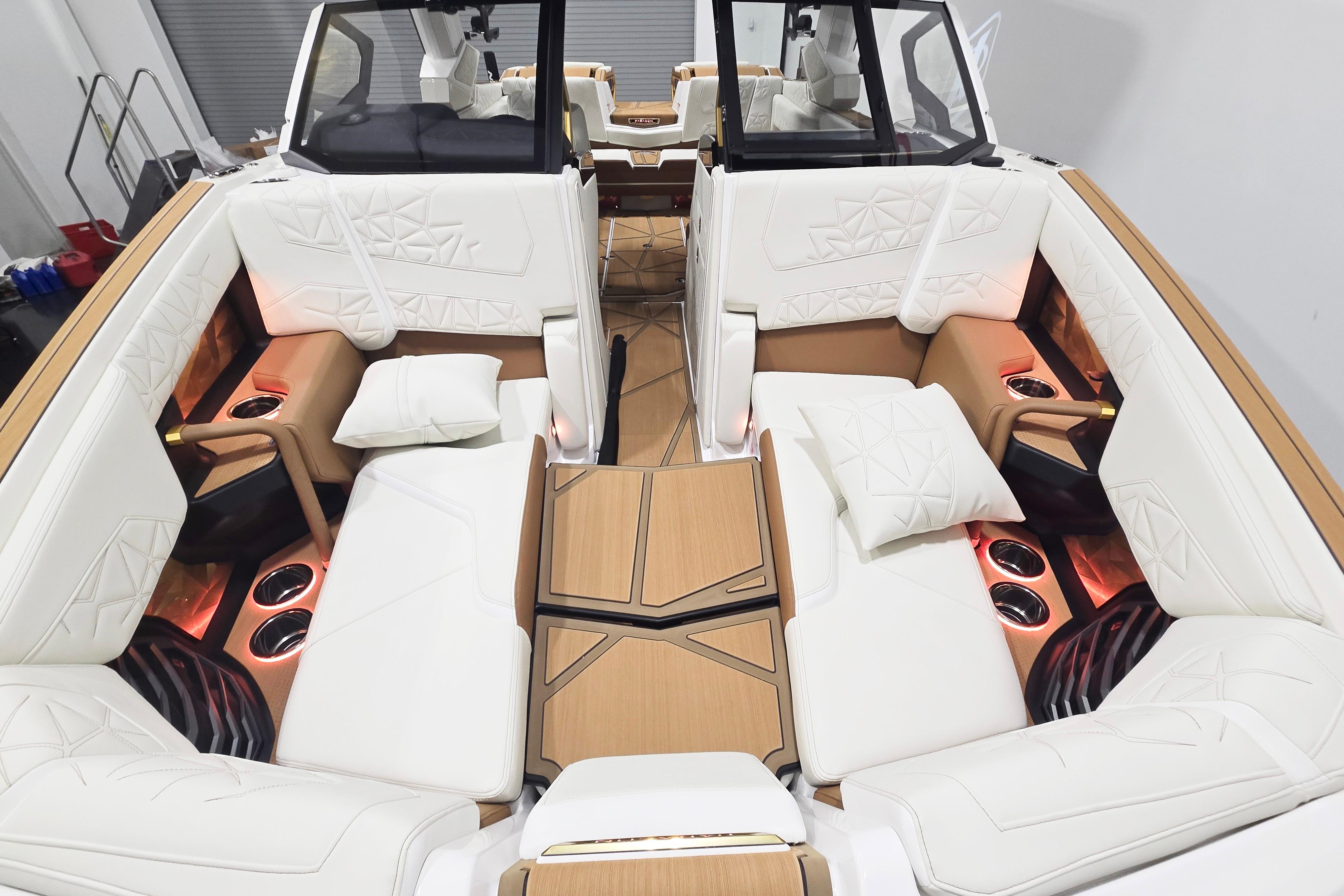 Luxurious interior of 2026 Nautique Super Air Nautique G23 Paragon with plush seating and ambient lighting.