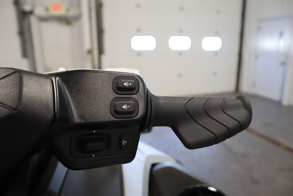 Handlebar controls of 2026 Sea-Doo GTX Limited 325 in a garage setting.