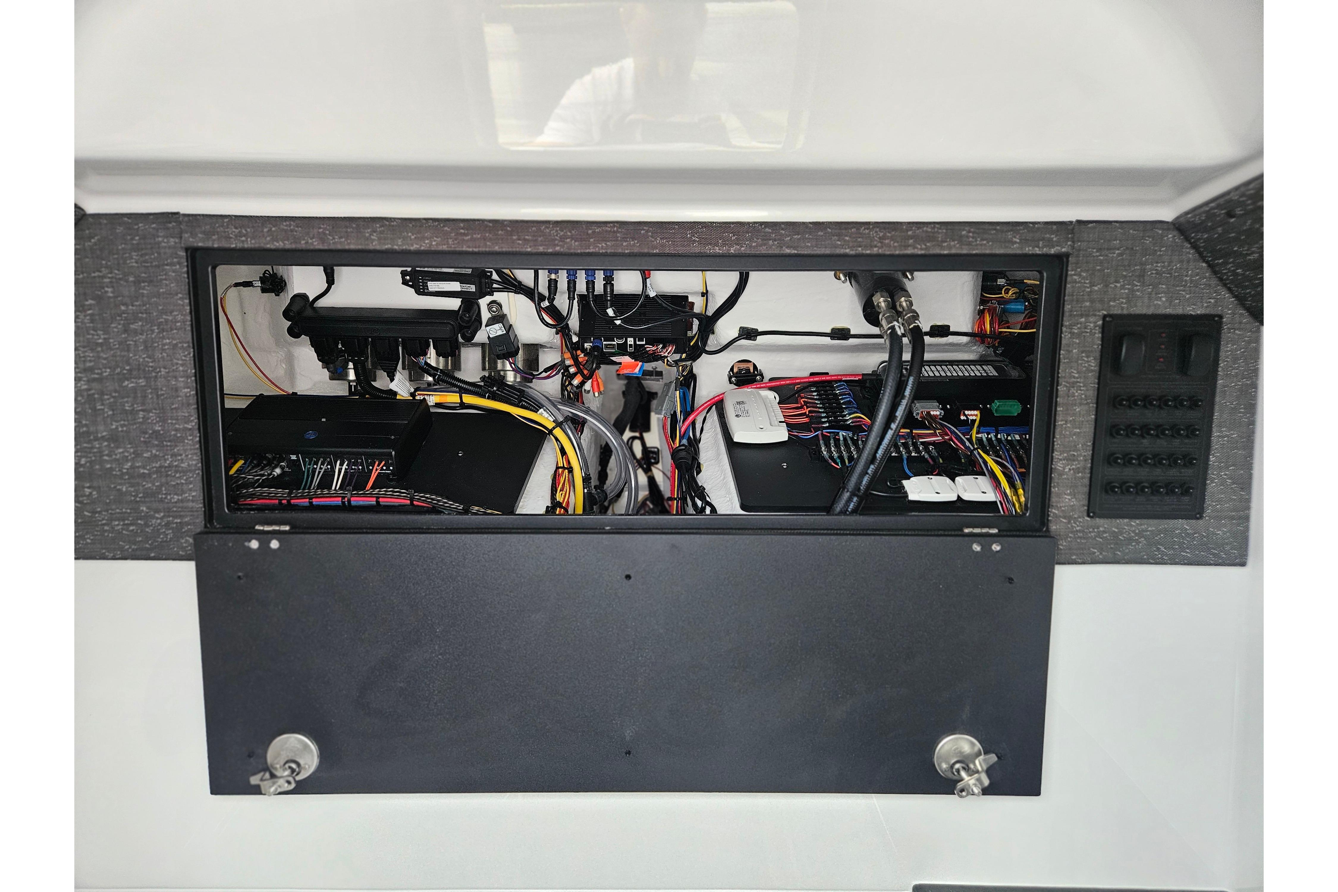 Electrical panel of 2026 Monterey Elite 27 OB boat, showcasing wiring and components.