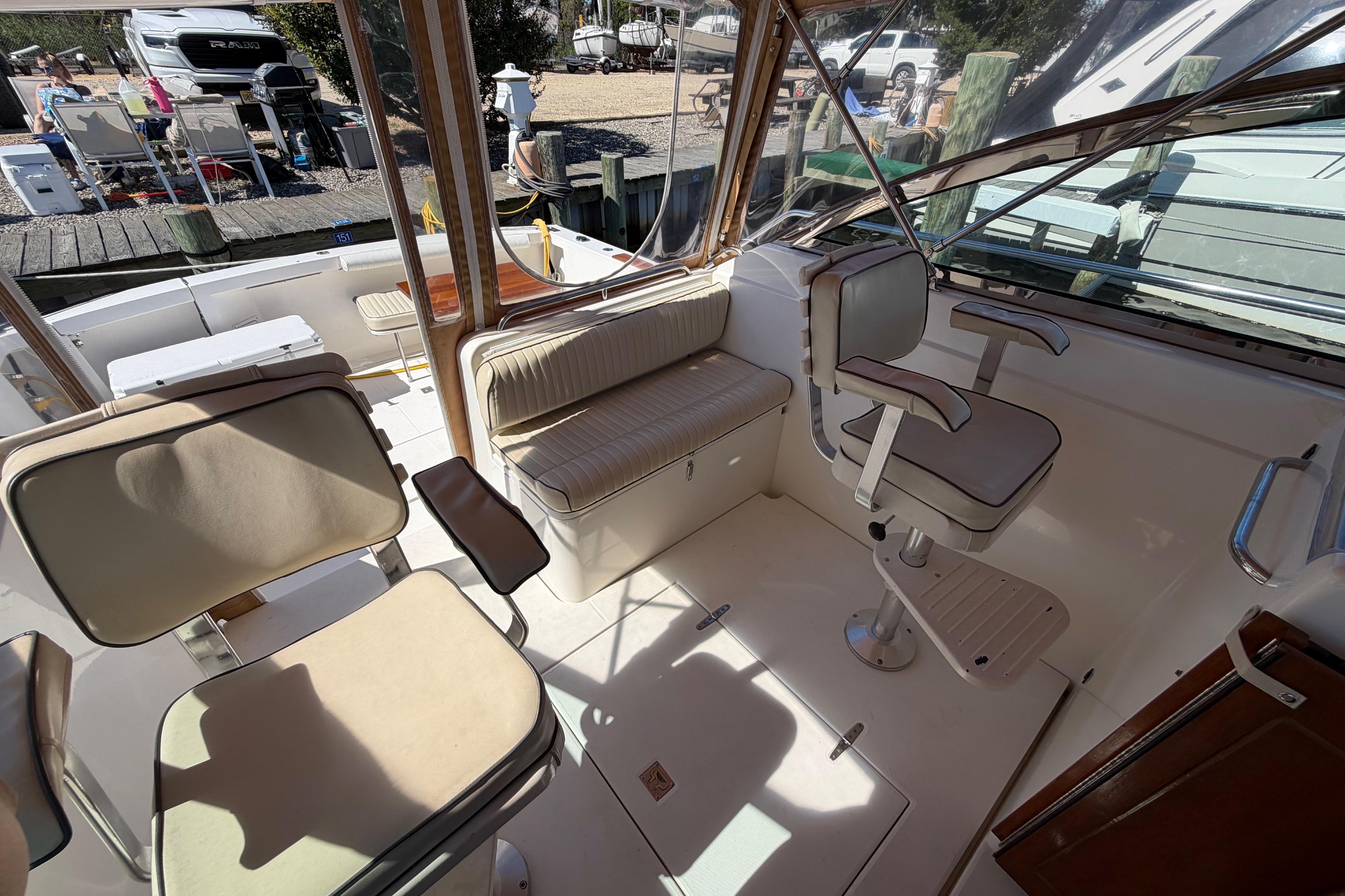 Interior of 2000 Sabreline 36 Express boat with seating and helm station.