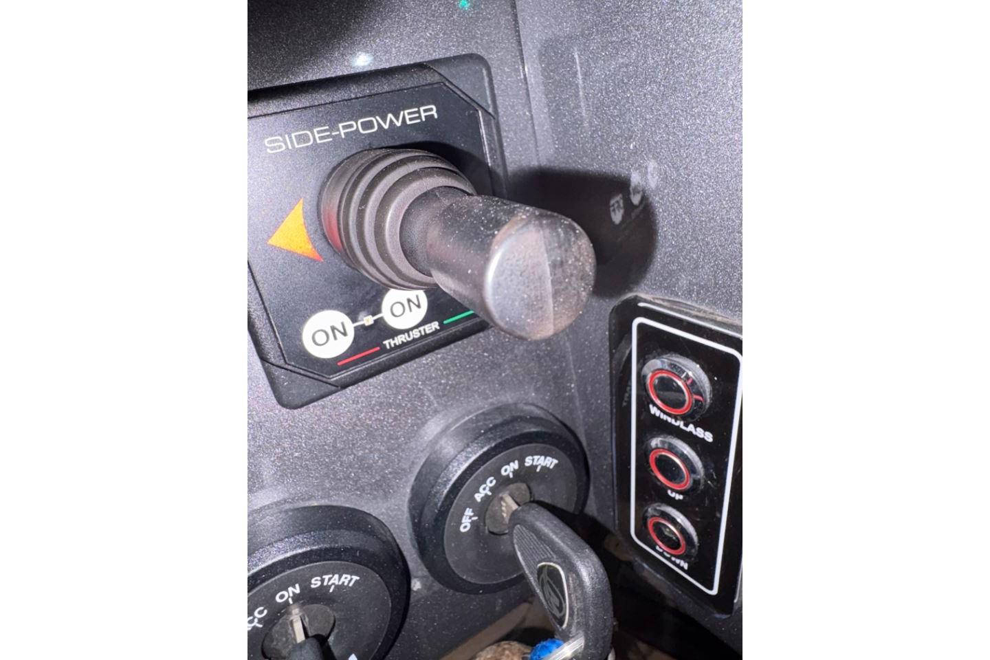 Control panel of 2021 Novamarine Black Shiver 100 with thruster and ignition switches.