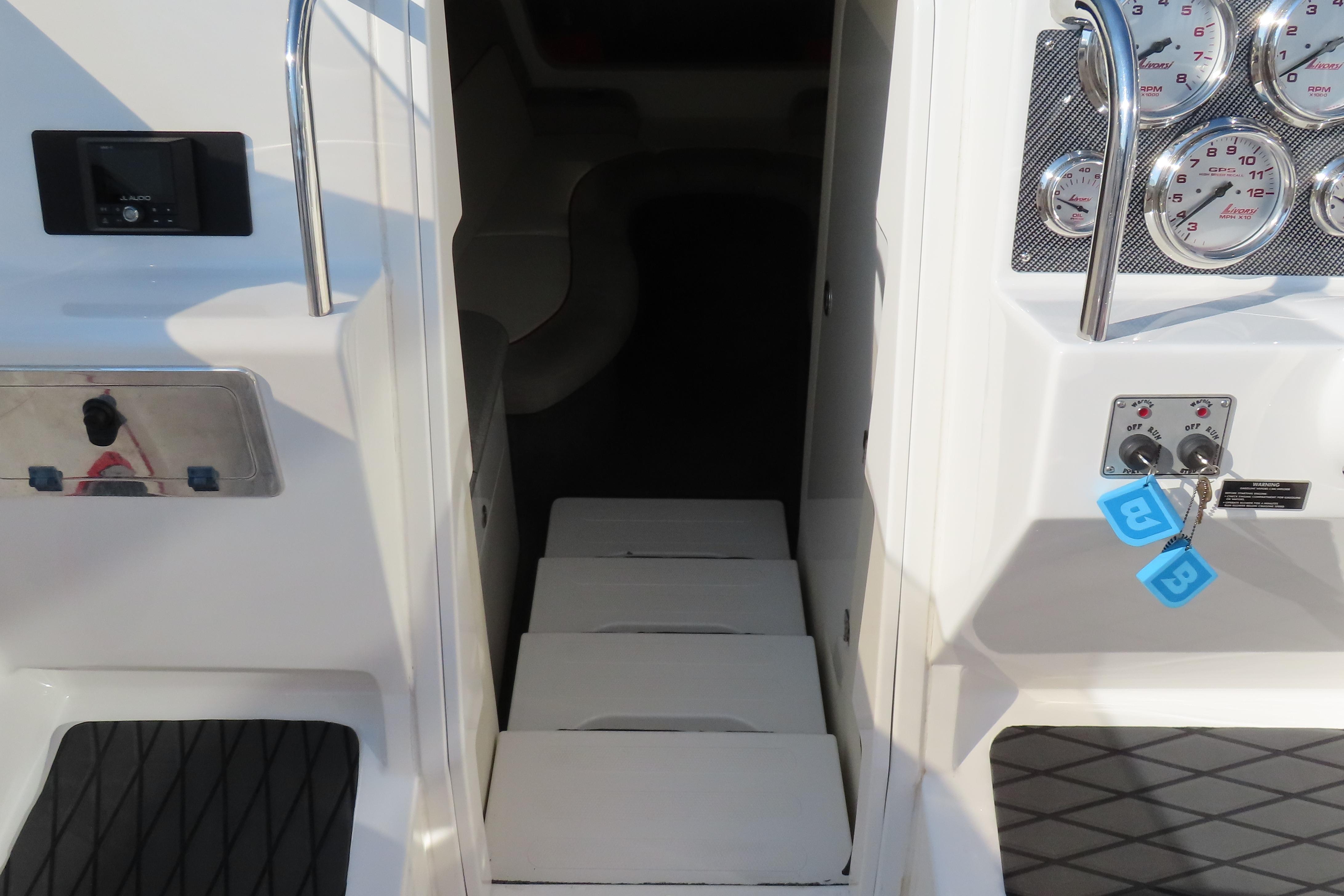 Interior view of a 2013 Nordic 39 POKER RUN boat, featuring gauges and cabin entrance.
