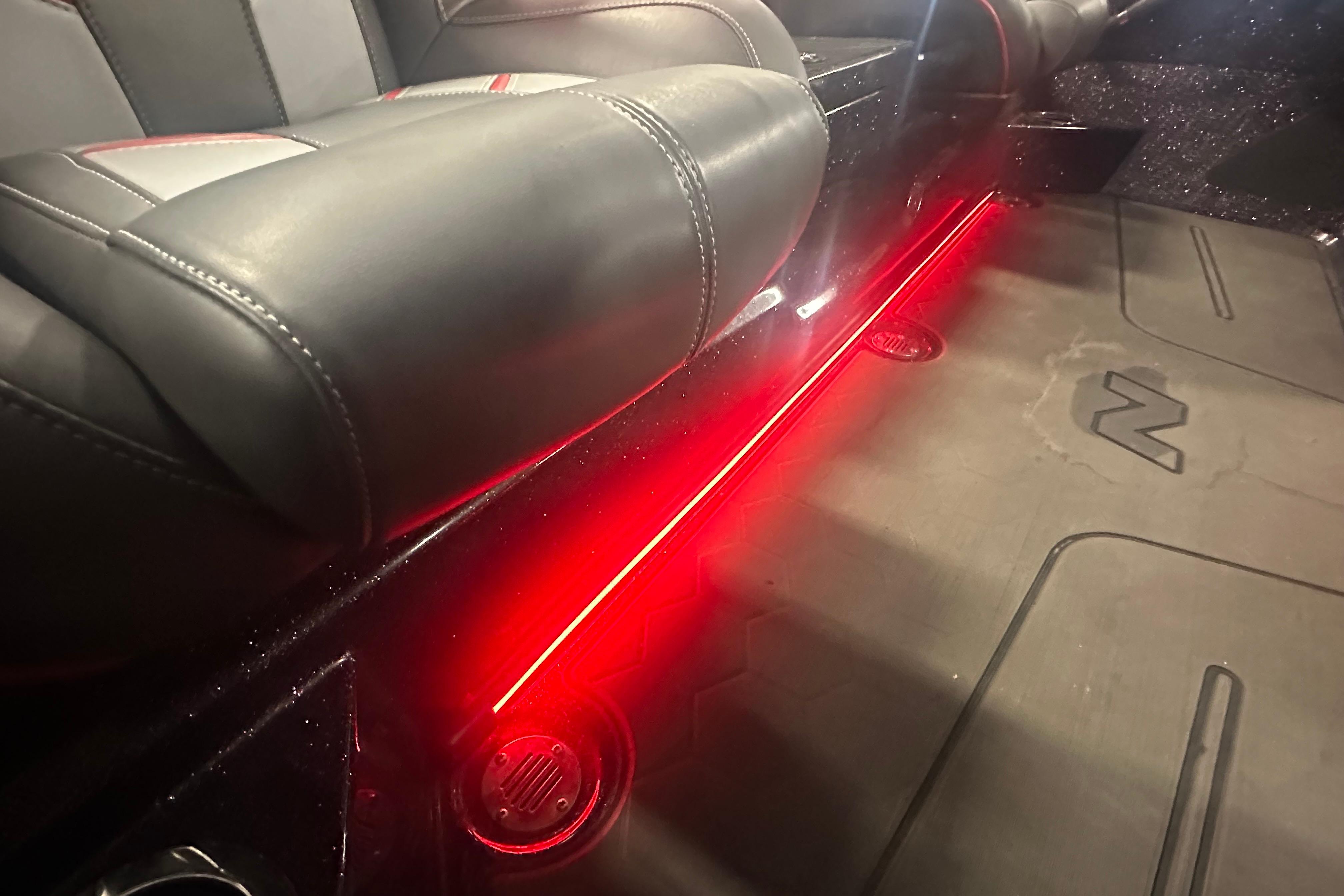 Interior of 2022 Nitro Z20 Pro with red LED lighting and leather seats.