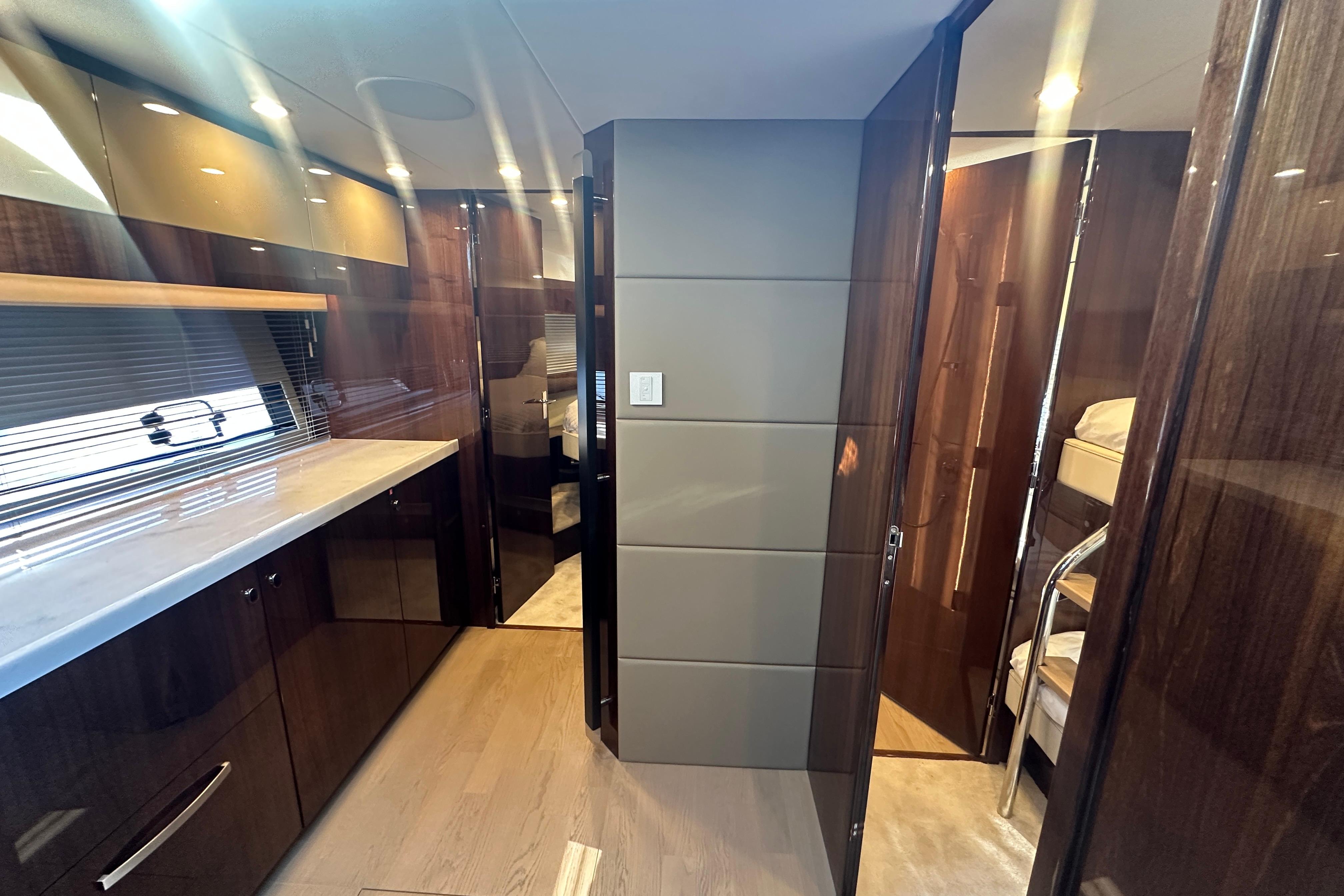 Luxurious interior of 2024 Fairline Squadron 50 yacht with modern wood finishes.