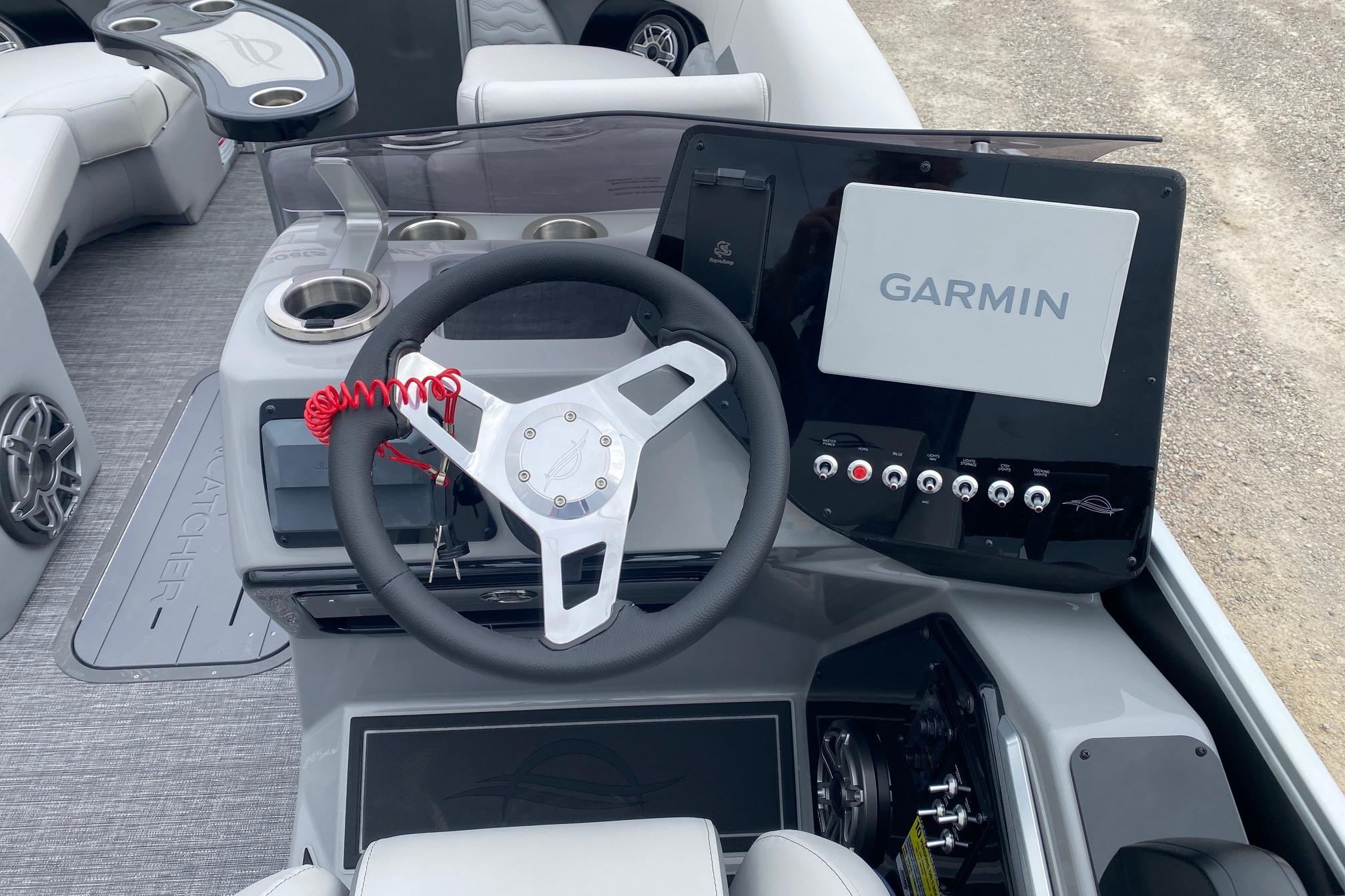 2026 SunCatcher Diamond Elite 324 SS boat dashboard with Garmin navigation system.