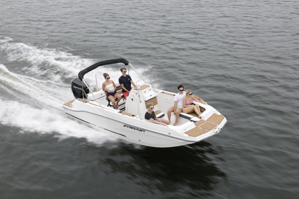 2025 Starcraft SVX 211 OB CC boat cruising with passengers on open water.