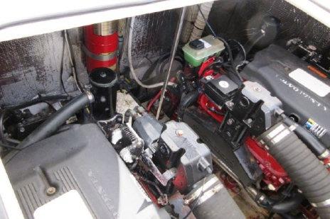 Engine compartment of a 2005 Cruisers Yachts 370 Express, showcasing mechanical components.