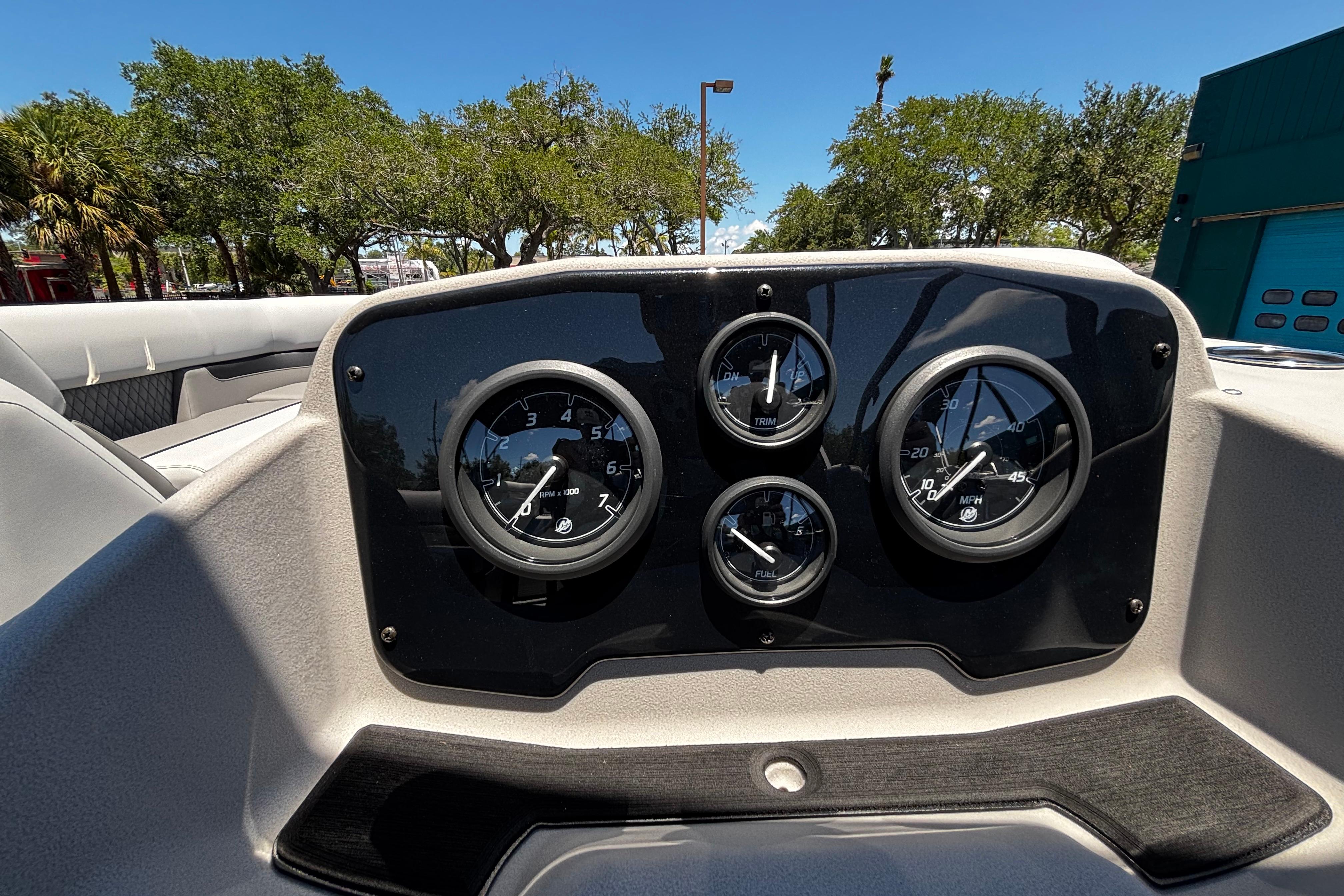 Dashboard of 2026 Princecraft Vectra 23 QL boat with gauges under clear blue sky.