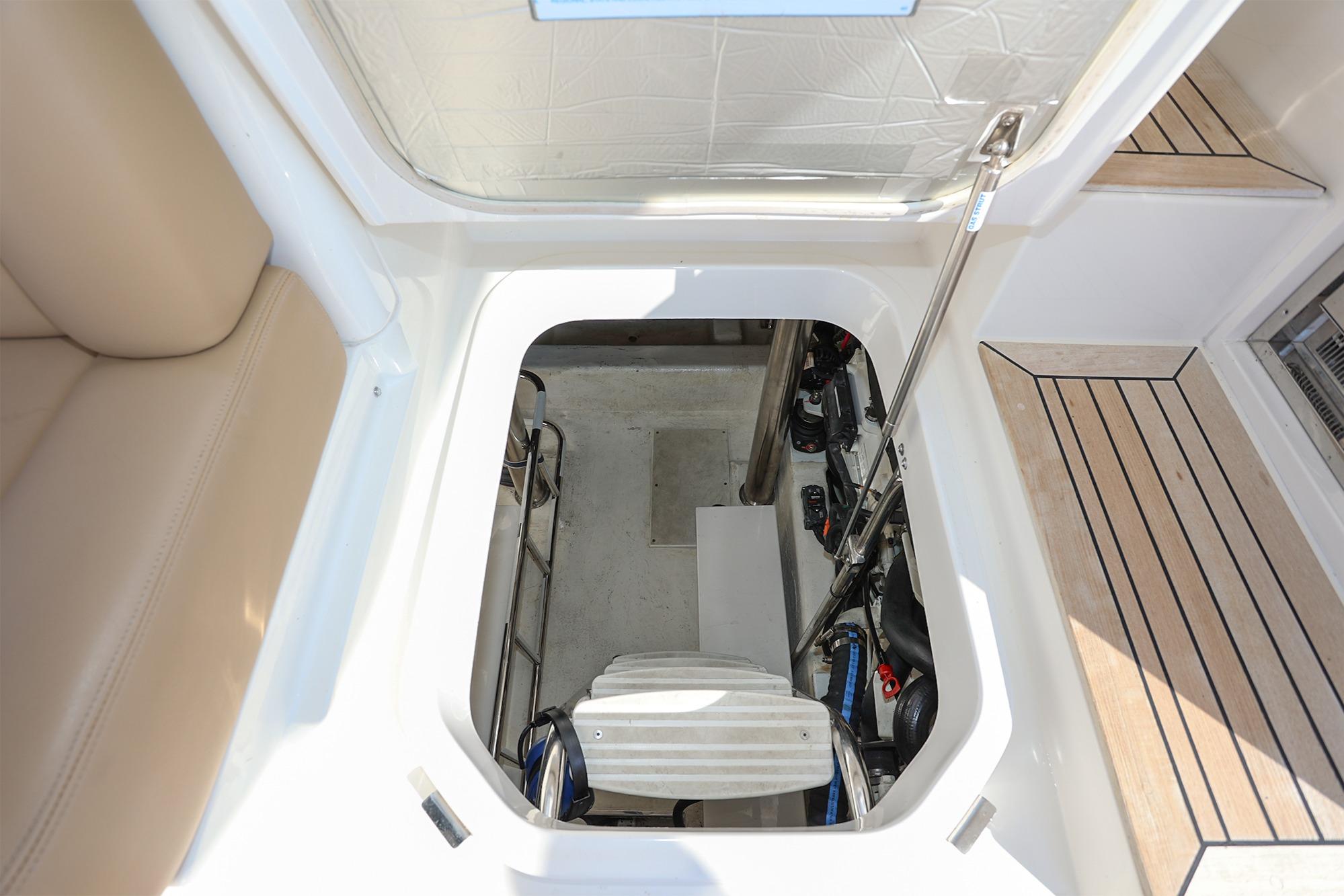 2016 Riviera 525 SUV engine compartment with open hatch and visible machinery.