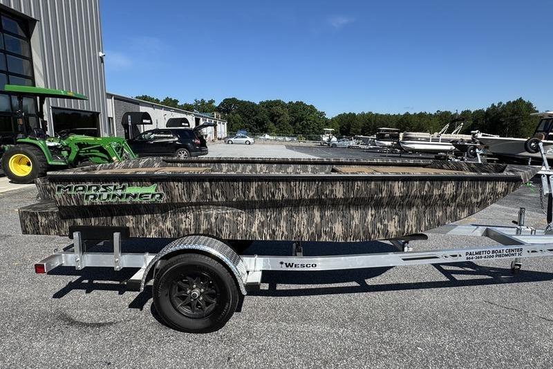2026 Havoc 1656 MRST MACH 1 boat on trailer, camo design, outdoor setting.