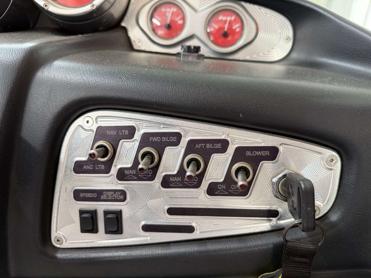 Dashboard of a 2006 MasterCraft X30 with switches and gauges.