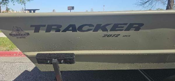 2025 Tracker GRIZZLY 2072 Utility boat side view with logo and model details.