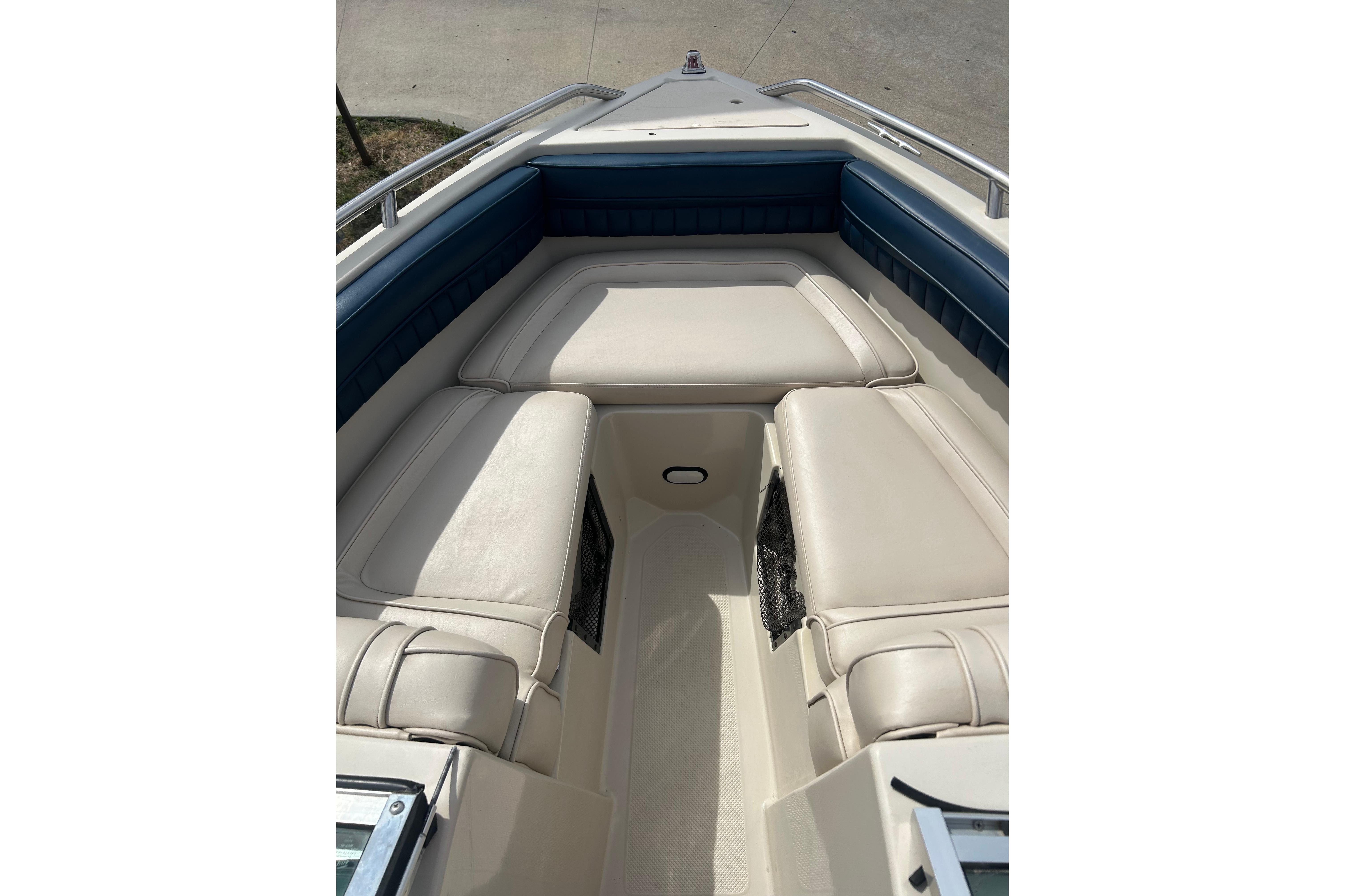 1996 Mariah 180 Shabah boat interior with beige and blue seating.