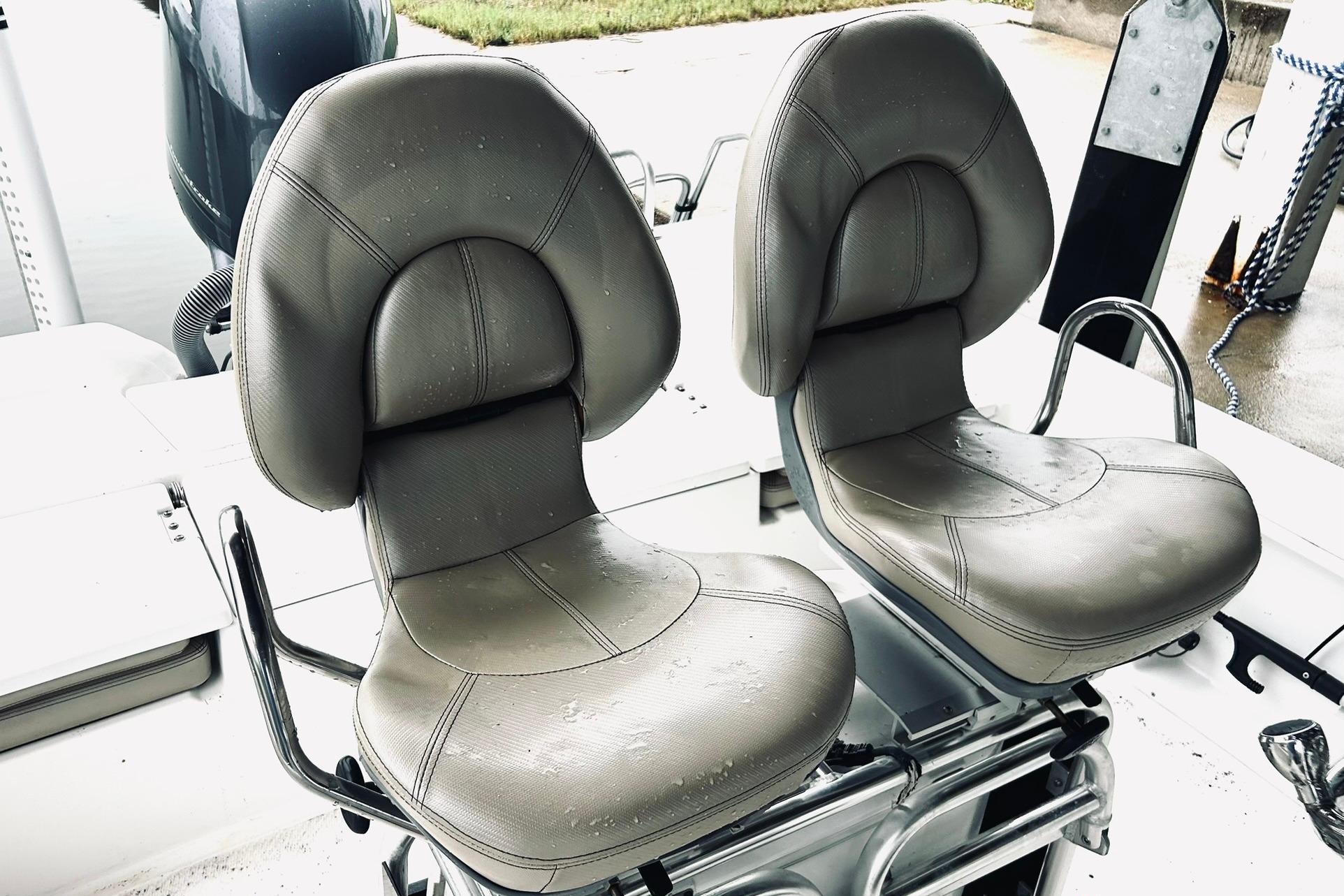 Two cushioned seats on a 2017 Blue Wave 2200 PureBay boat.