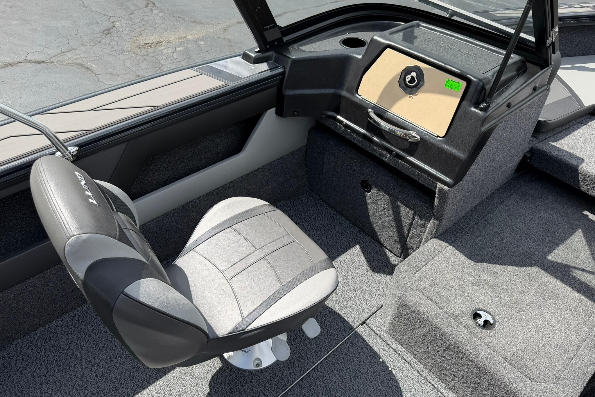 Interior of 2027 Lund 1875 Crossover XS boat with gray seating and dashboard.