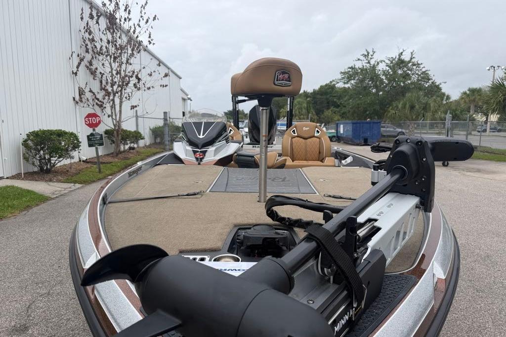 2026 Ranger Z520R boat with trolling motor, parked outdoors near a building.