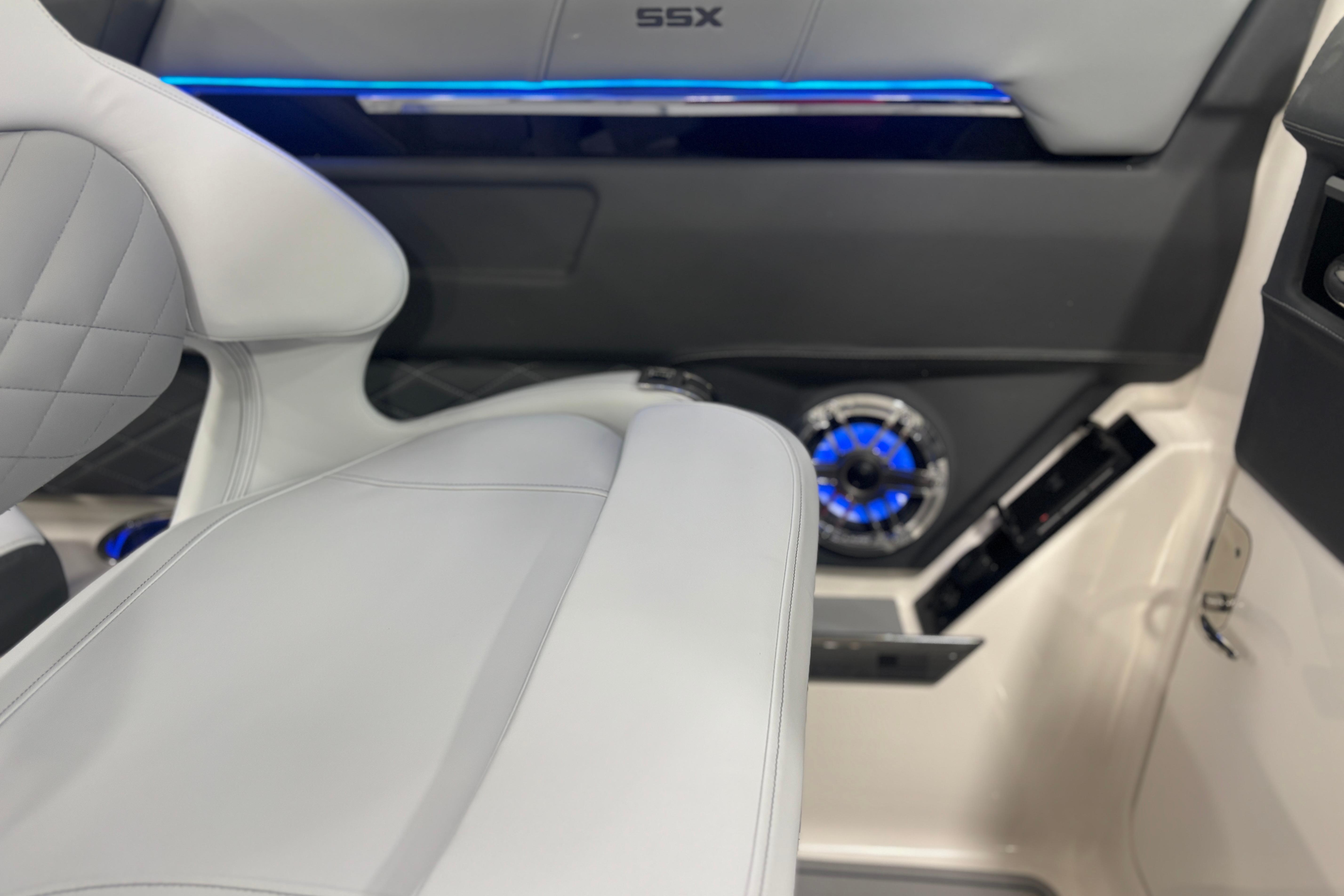 2026 Chaparral SSX 30 interior with modern seating and illuminated speaker system.