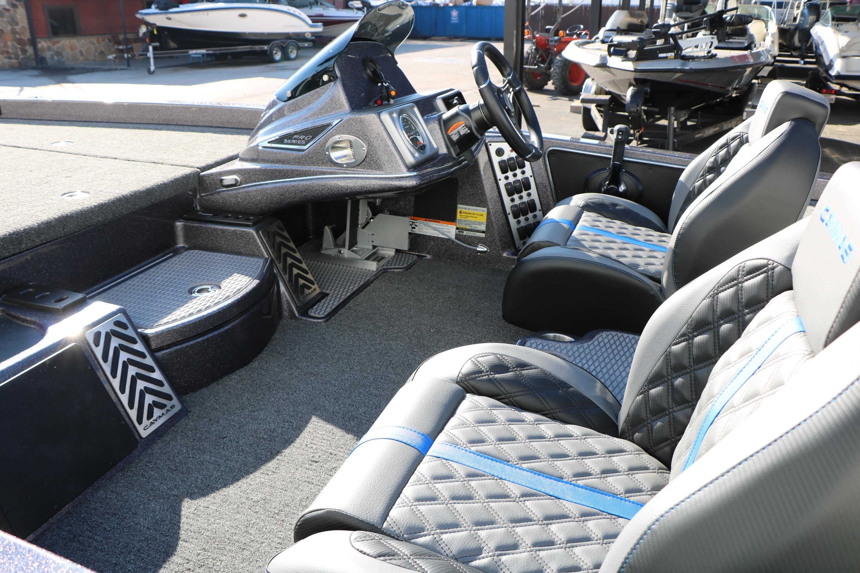 2027 Caymas 201 Pro boat interior with modern dashboard and comfortable seating.