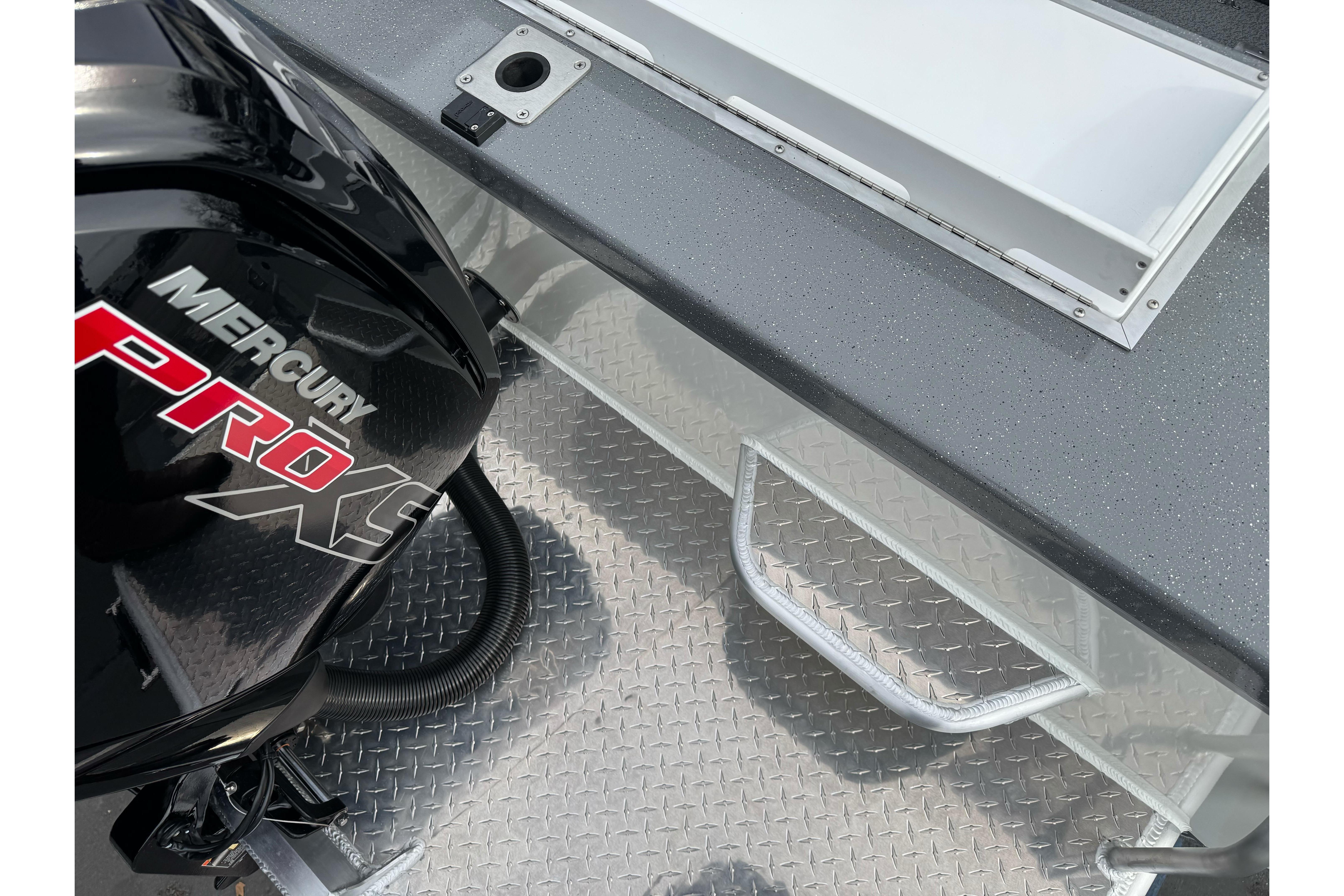2026 Lund 185 Heavy Gauge boat with Mercury Pro XS engine and diamond plate flooring.