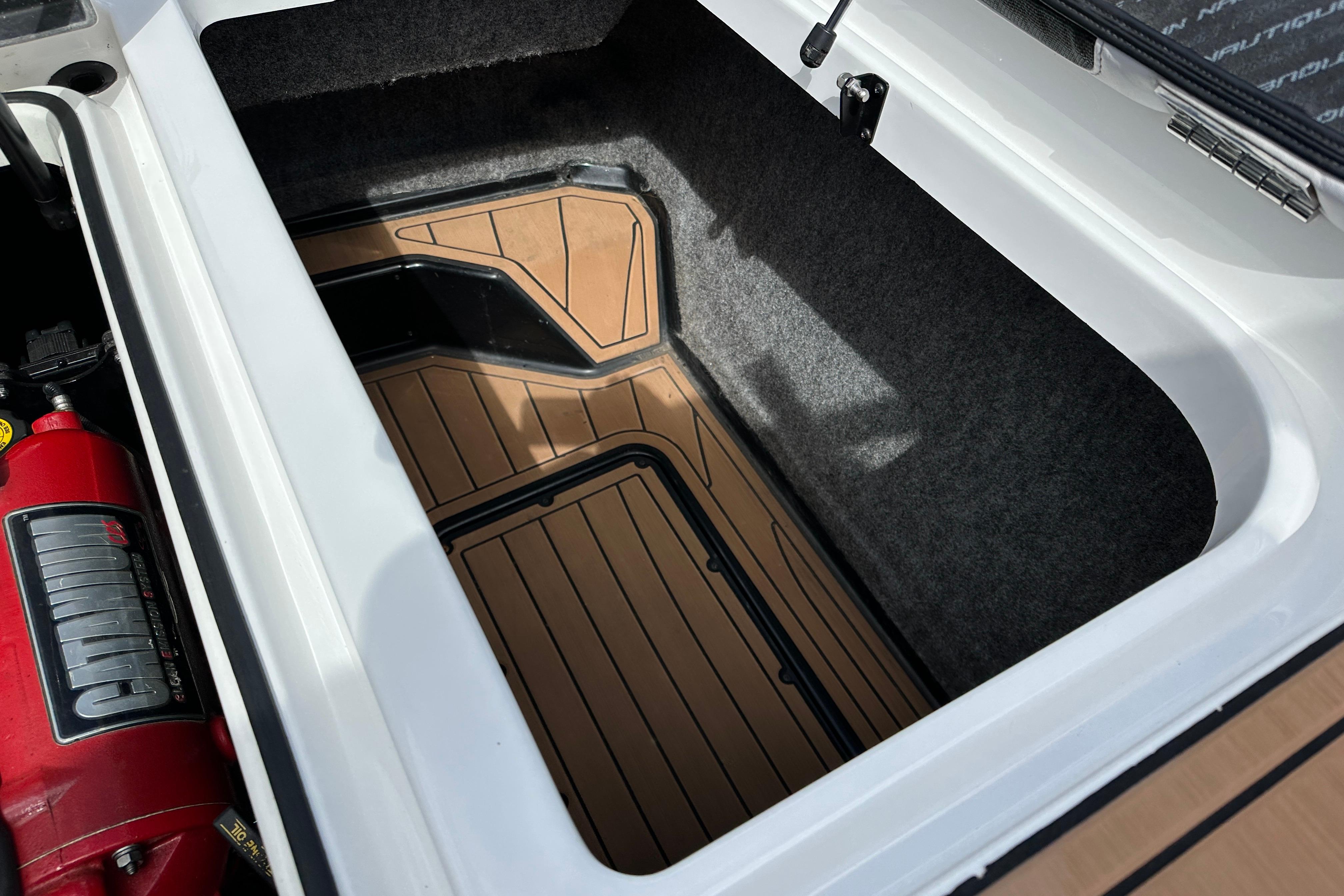 Storage compartment of a 2017 Nautique Super Air Nautique GS20 boat.