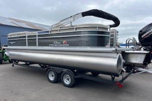 2024 Sun Tracker Party Barge 24 DLX pontoon boat on trailer.