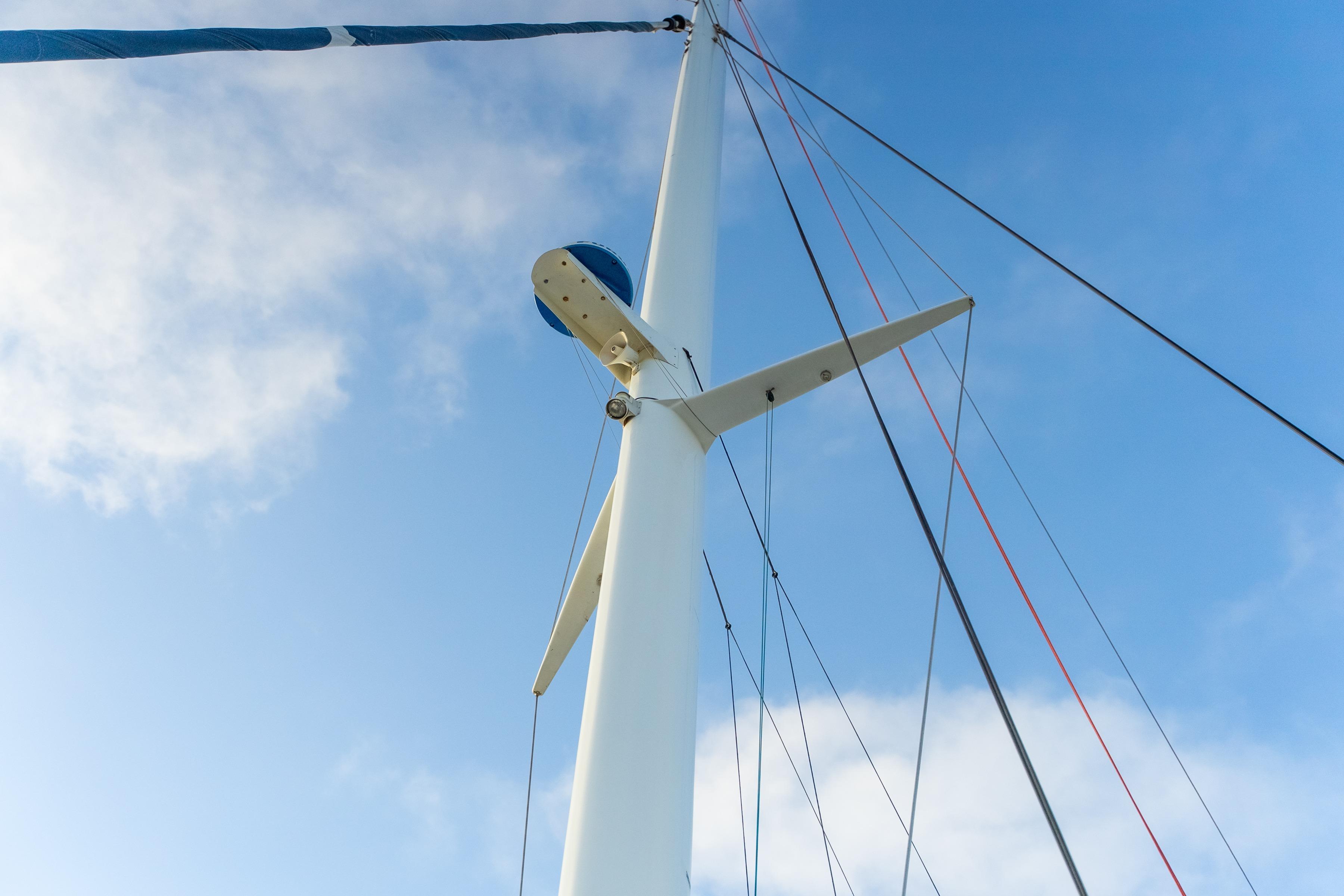 Mast of 2009 Catana 65 sailboat against a clear blue sky.