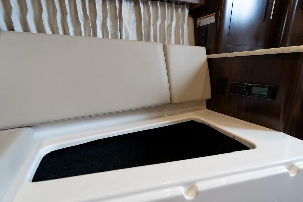 Interior seating and storage of 2016 Regal 28 Express boat.