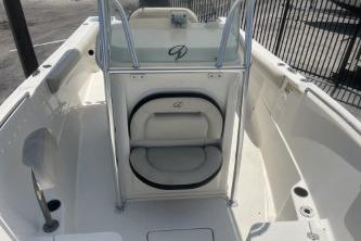 2023 Sailfish 242 CC boat interior, featuring sleek white seating and modern design.
