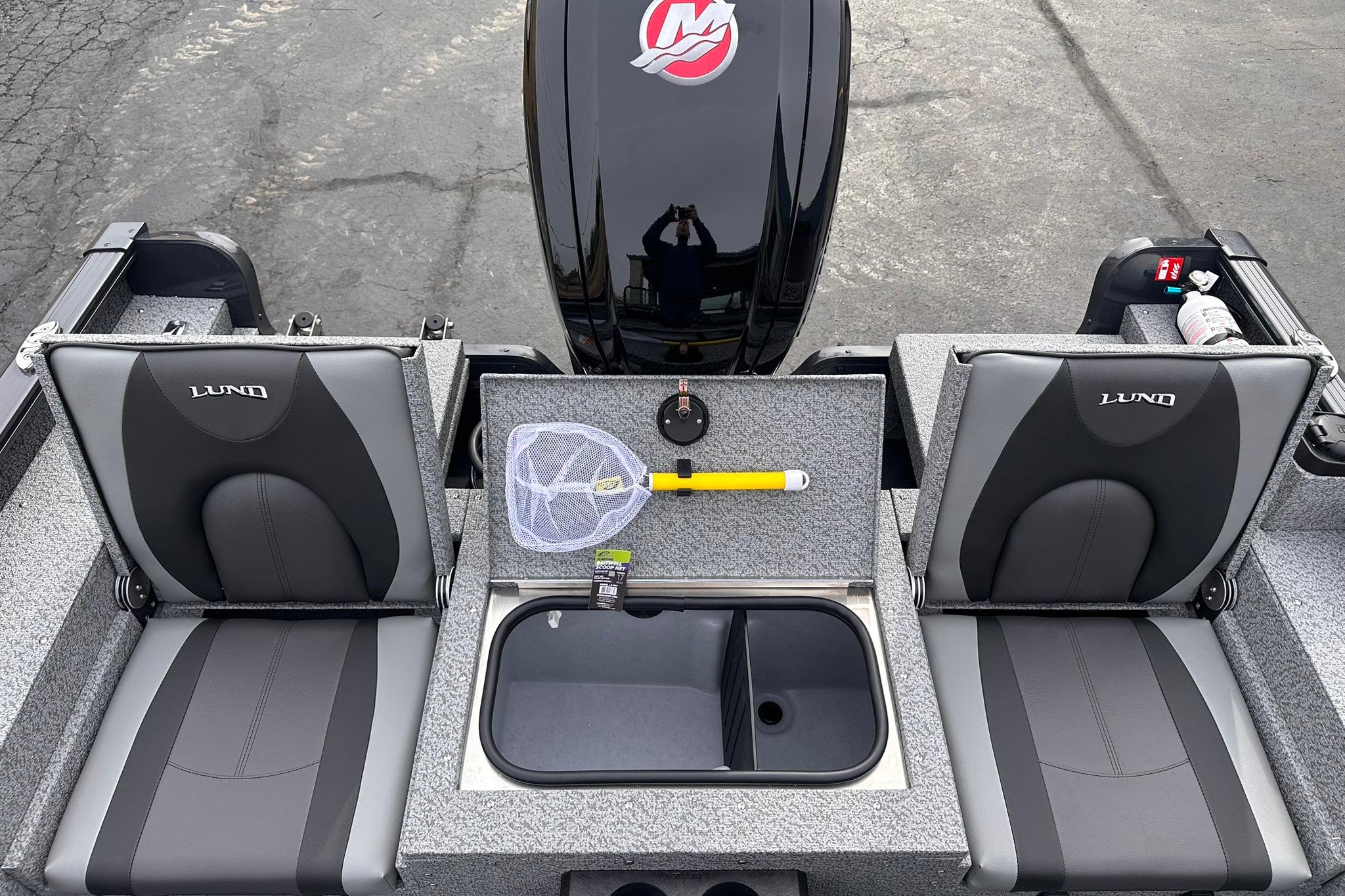 2026 Lund 1775 Adventure Sport boat interior with seats, storage, and fishing gear.