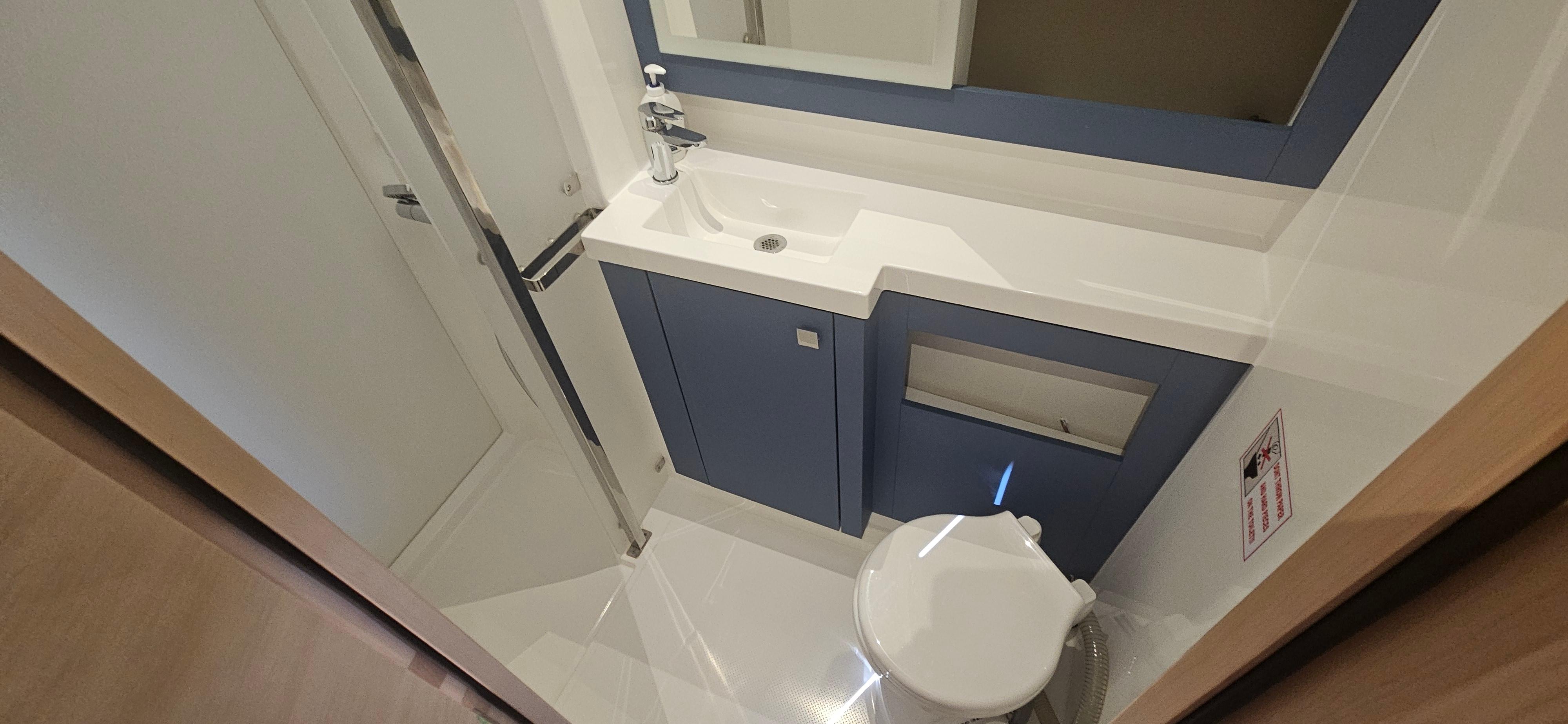 2024 Fountaine Pajot Tanna 47 yacht bathroom with modern fixtures and sleek design.