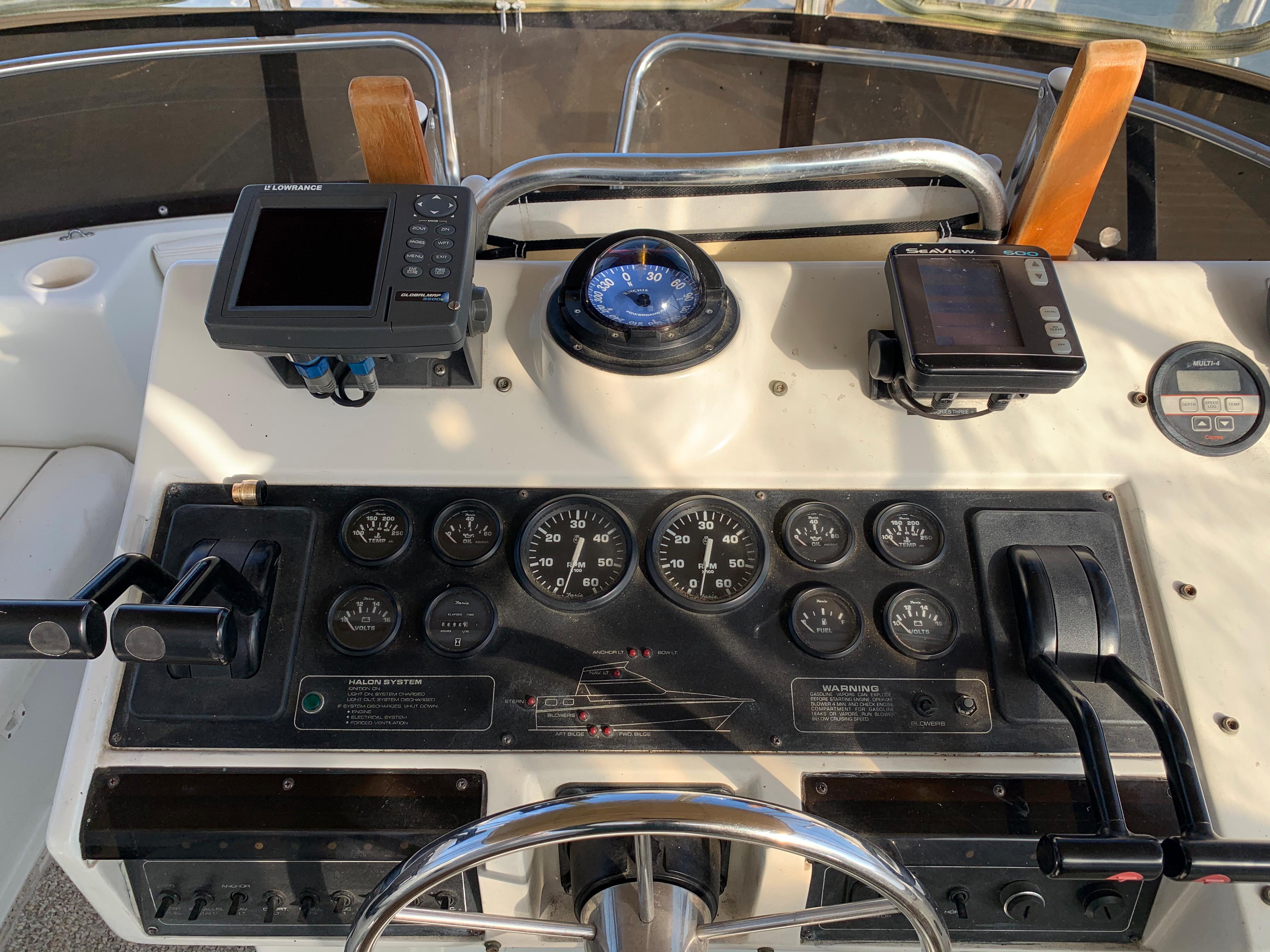 Control panel of a 1992 Silverton 34 Aft Cabin Motor Yacht with navigation instruments.