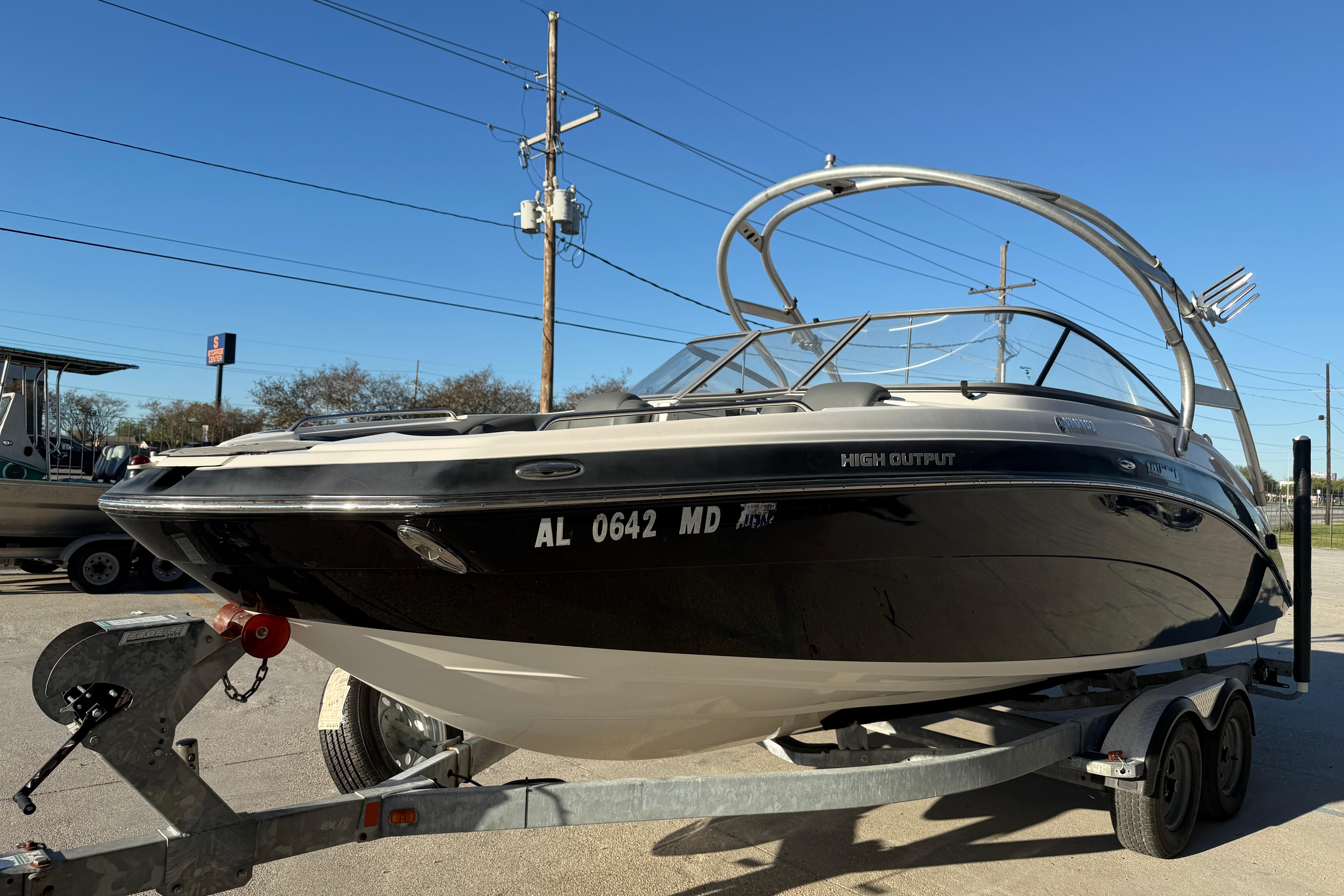 2011 Yamaha Boats 242 Limited S on trailer, high output model, sunny day.