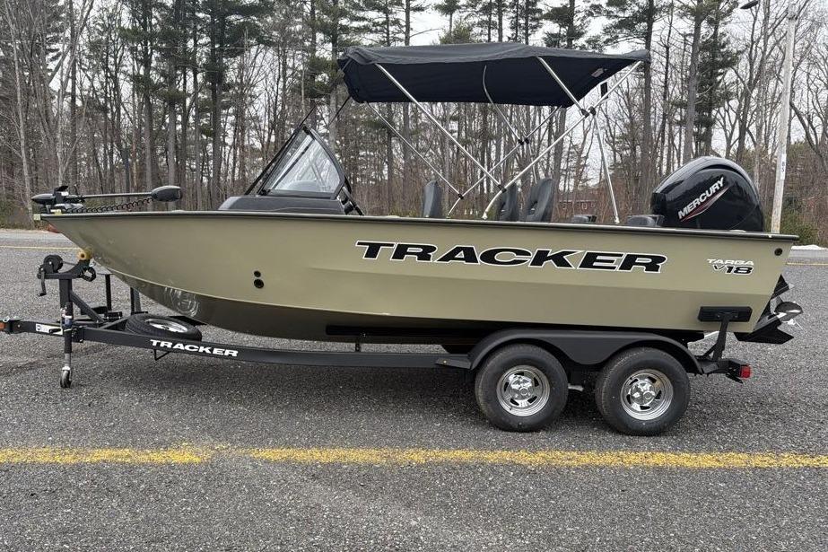 2026 Tracker Targa V-18 Combo boat on trailer, parked outdoors.