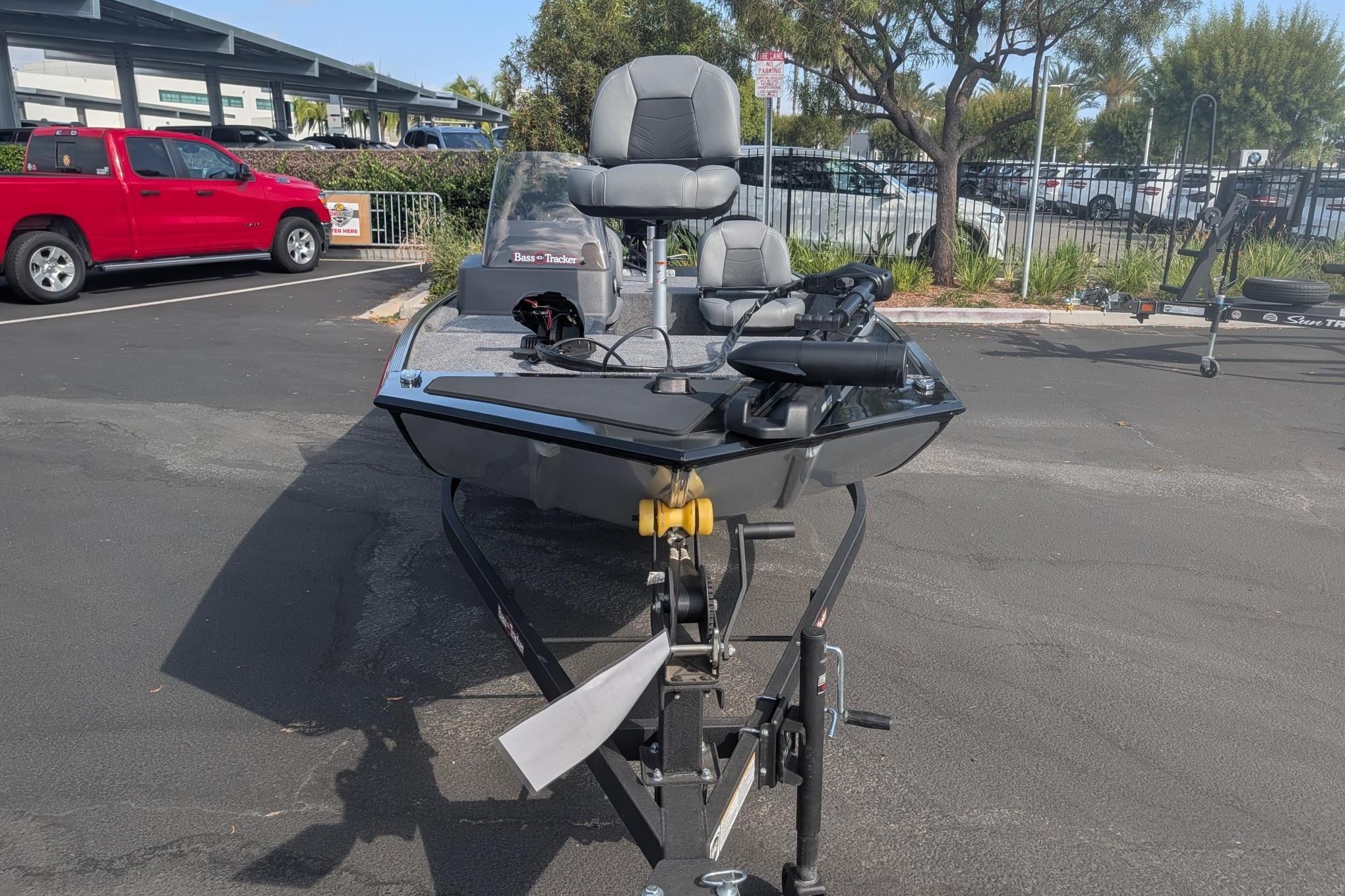 2026 Tracker Bass Tracker Classic XL boat on trailer in parking lot.