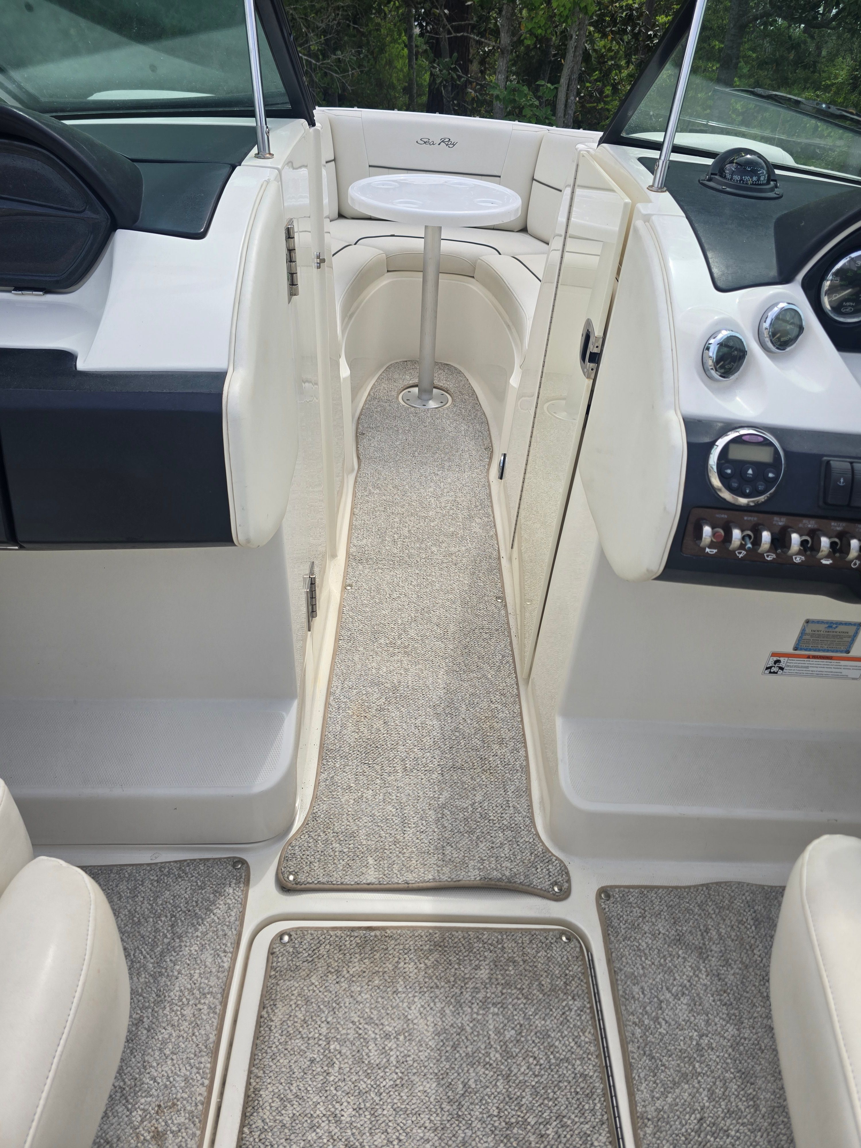 Interior of a 2007 Sea Ray 270 Select EX with carpet flooring.