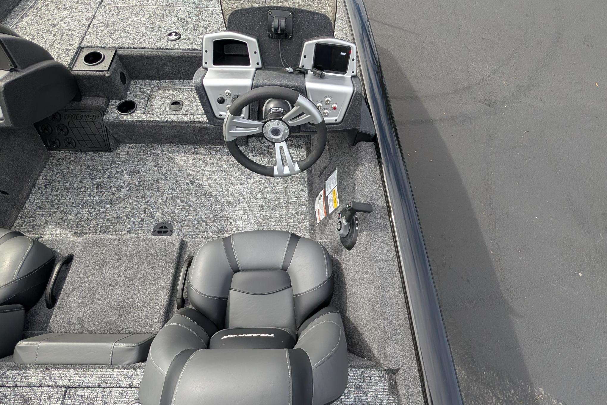 2026 Tracker Pro Team 195 boat interior with steering wheel and control panel.