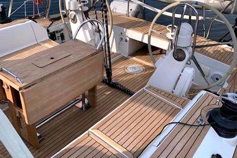 2006 Grand Soleil 50 yacht cockpit with teak decking and dual steering wheels.