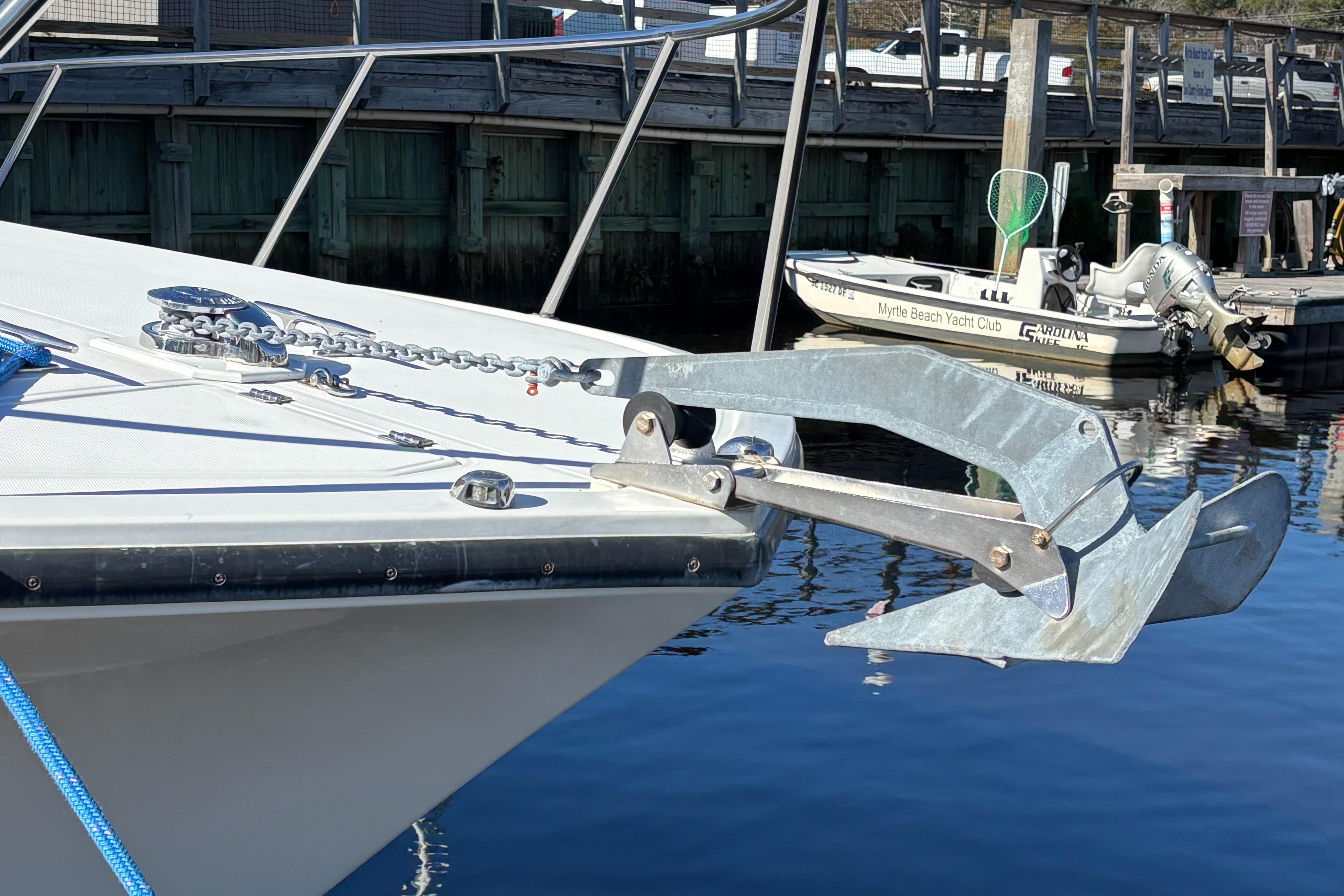 2001 Carolina Classic 35 boat with anchor at dockside.