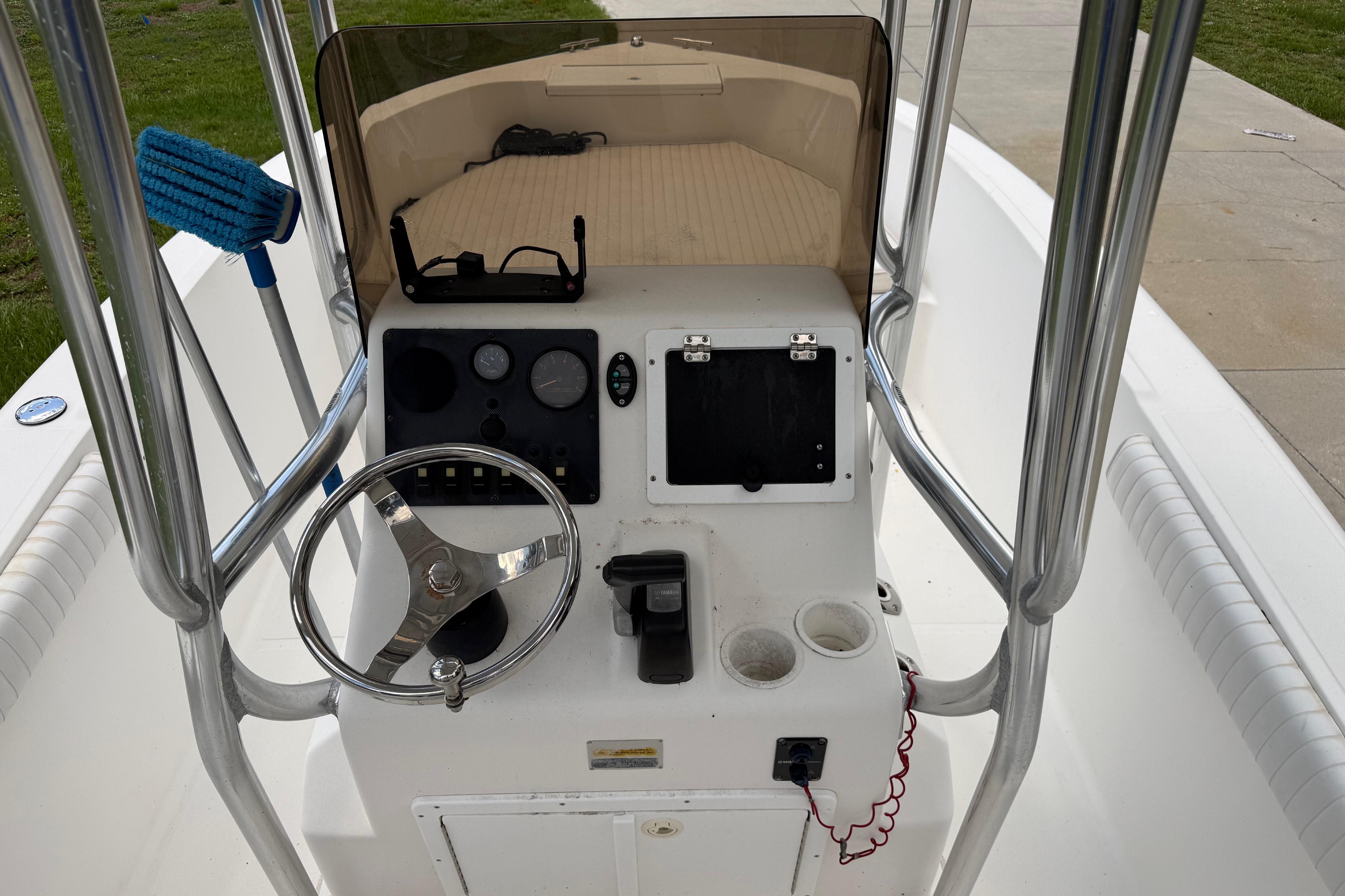 Clearwater 2000 Center Console boat interior, featuring steering wheel and control panel, 2012 model.