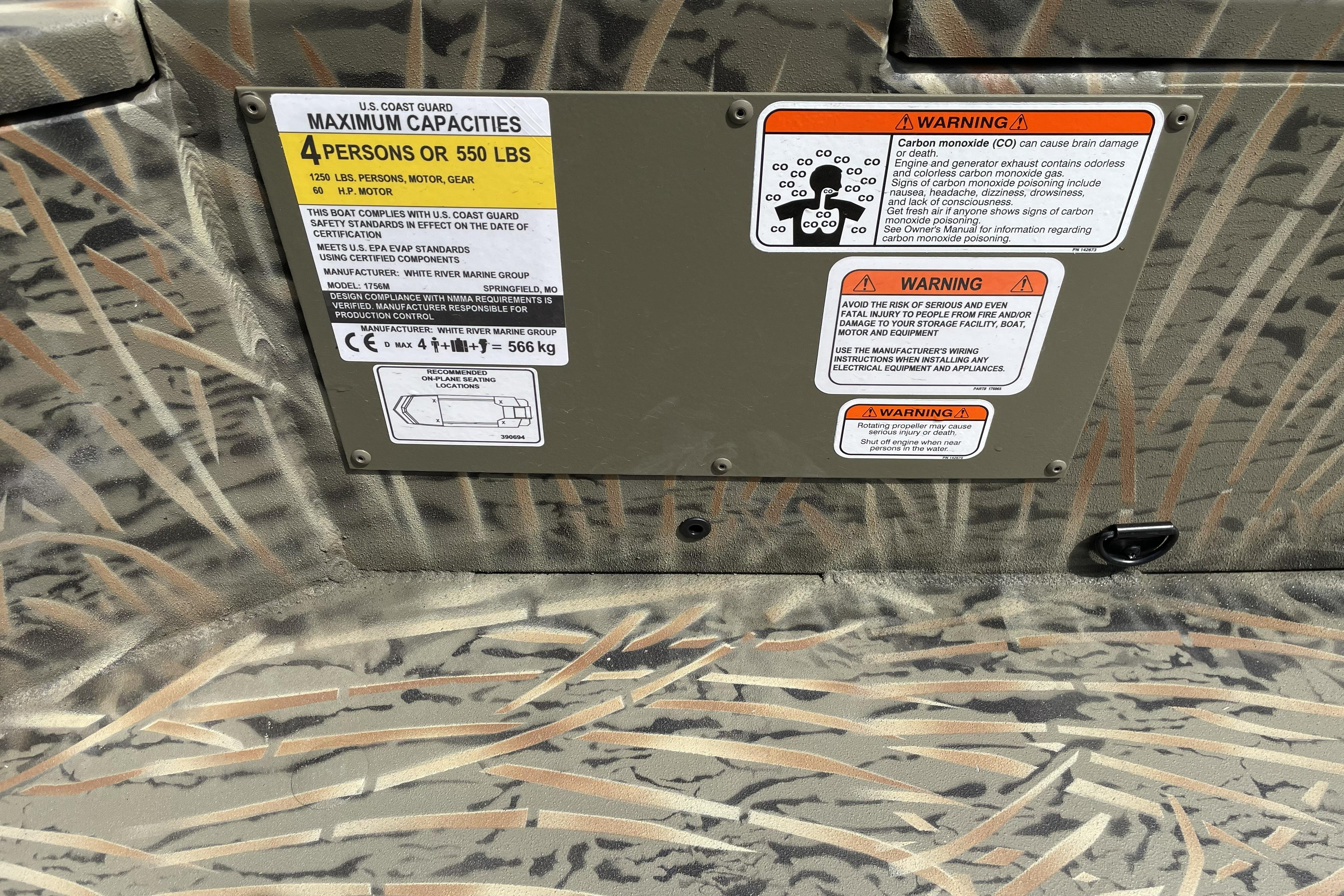 2026 Tracker Grizzly 1756 T Marsh boat capacity and safety warning labels.