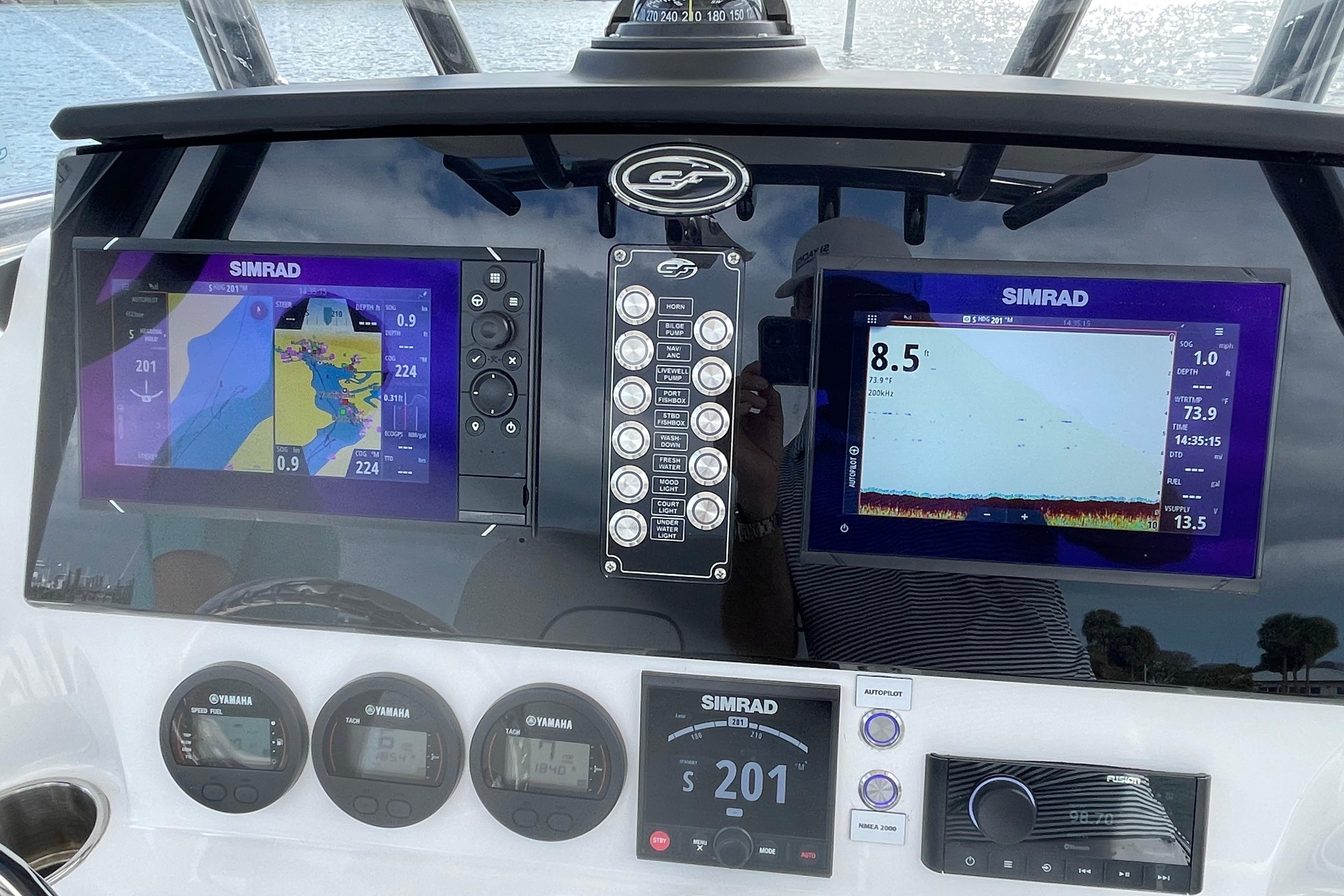 2023 Sea Fox 268 Commander dashboard with Simrad navigation displays and controls.