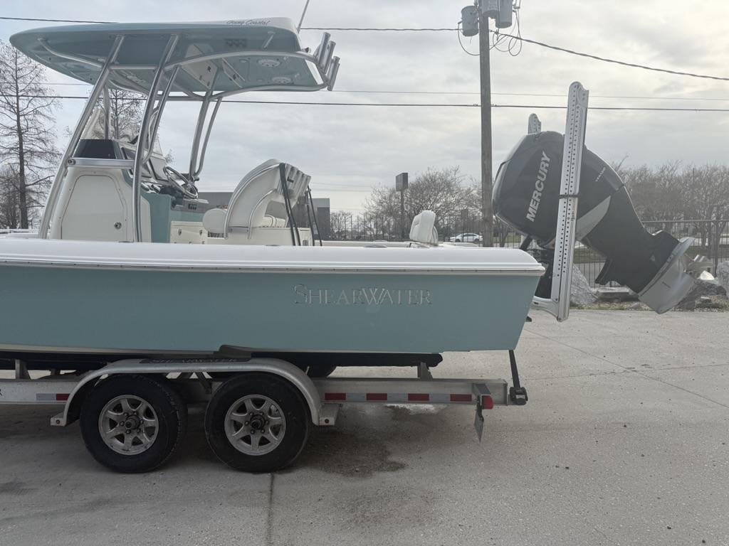 2017 ShearWater 270 Carolina Flare boat on trailer with Mercury engine.