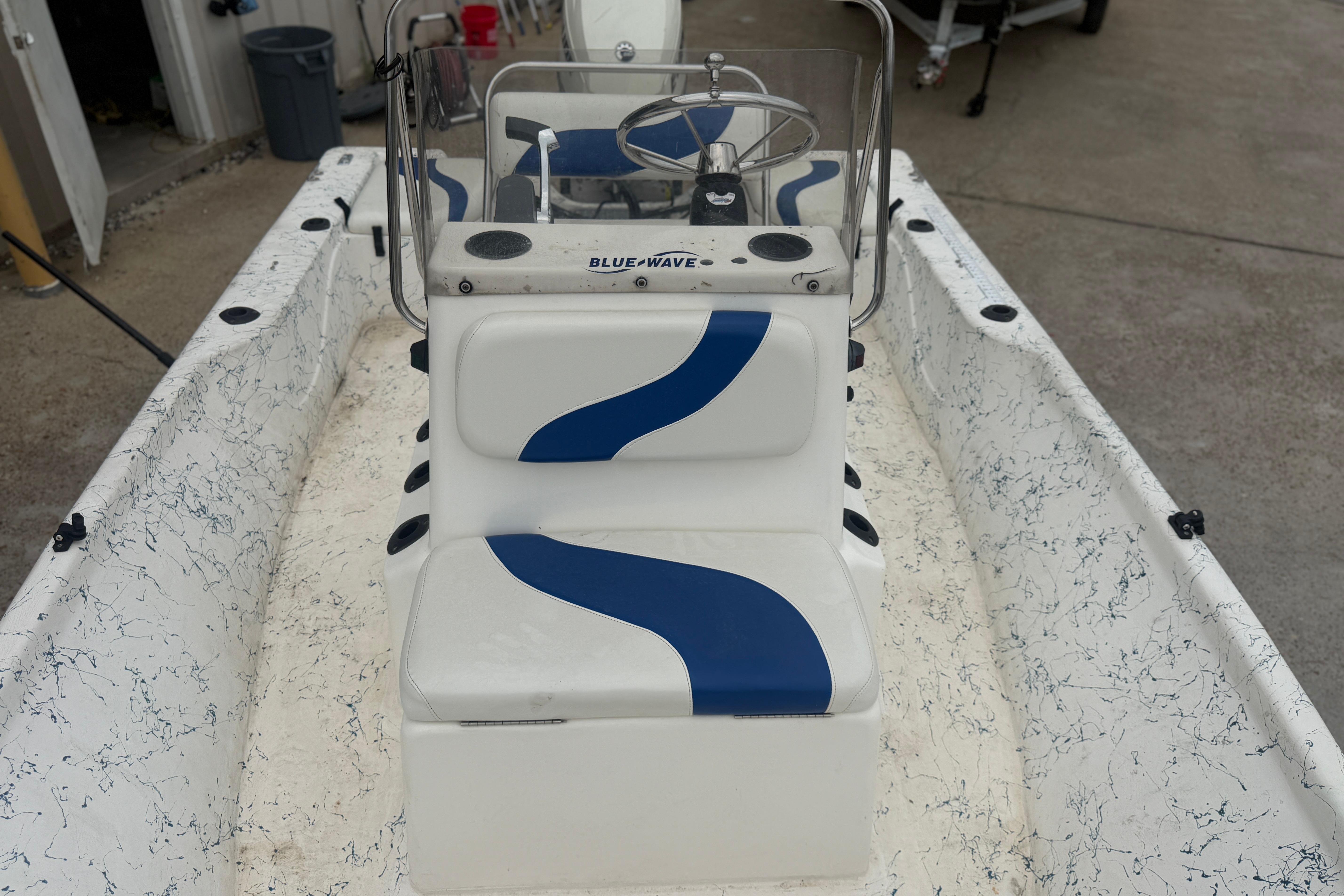 2004 Blue Wave 160 V-Bay boat interior with blue and white seating design.