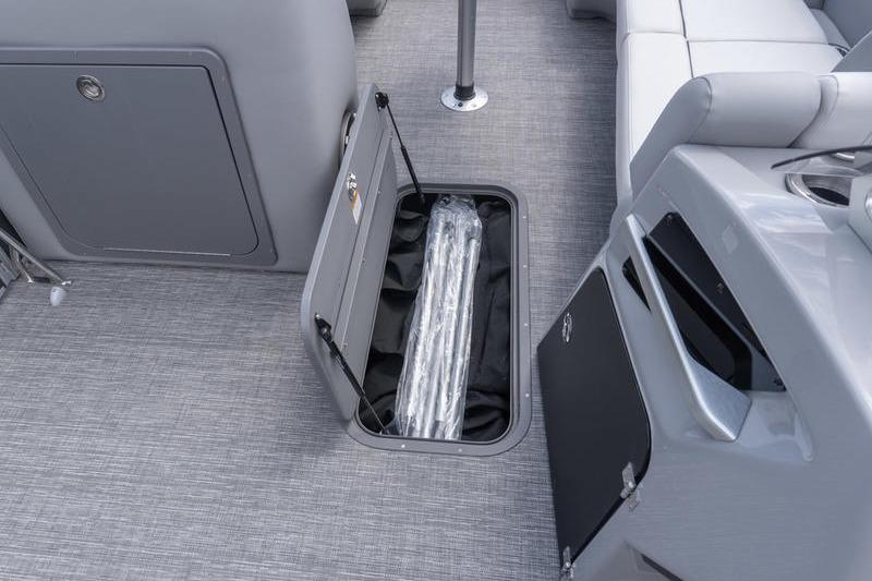 2026 SunCatcher Elite 326 SL boat interior with open storage compartment.