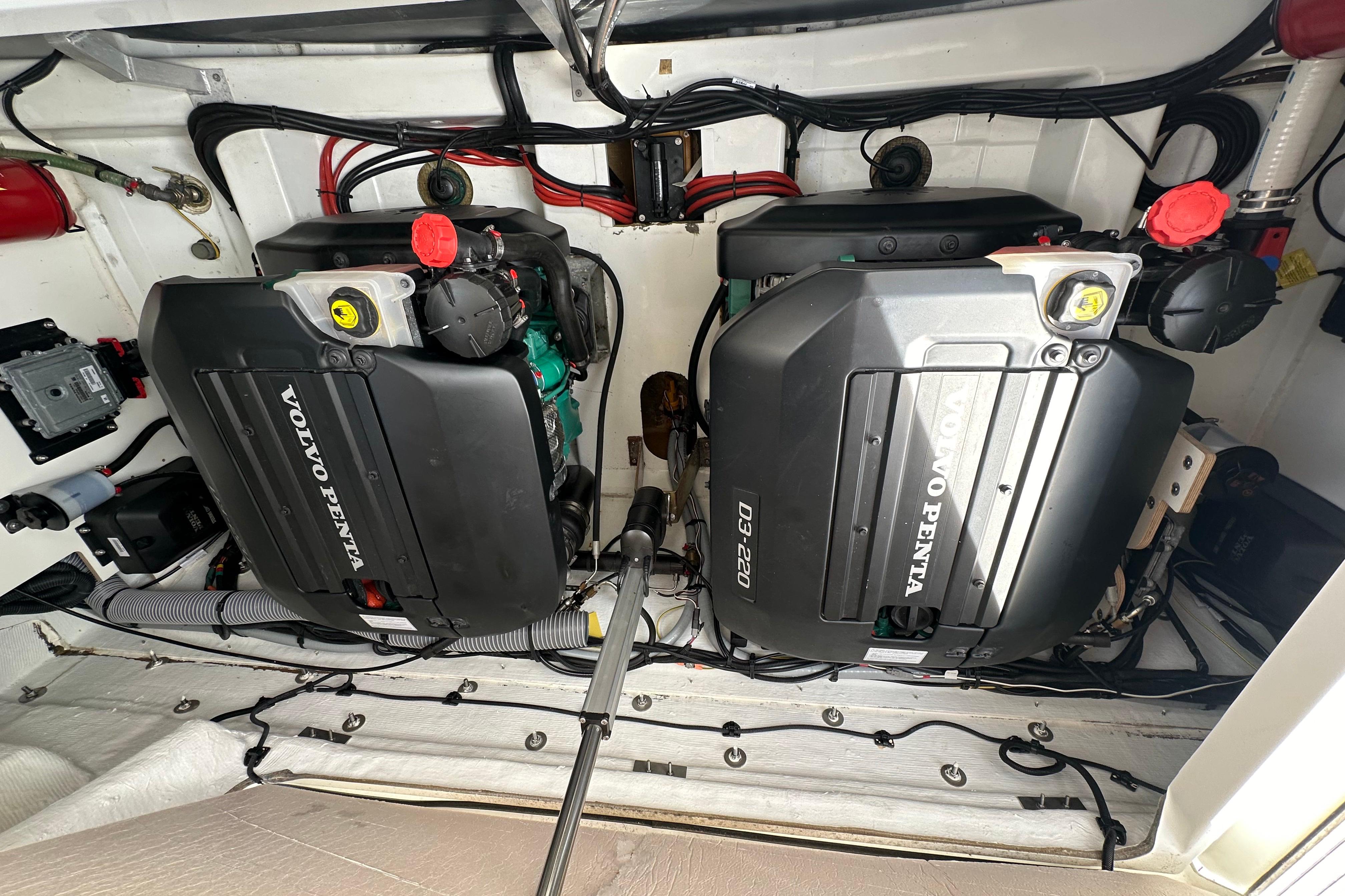 Engine compartment of a 2020 Jeanneau Leader 33 with twin Volvo Penta D3-220 engines.